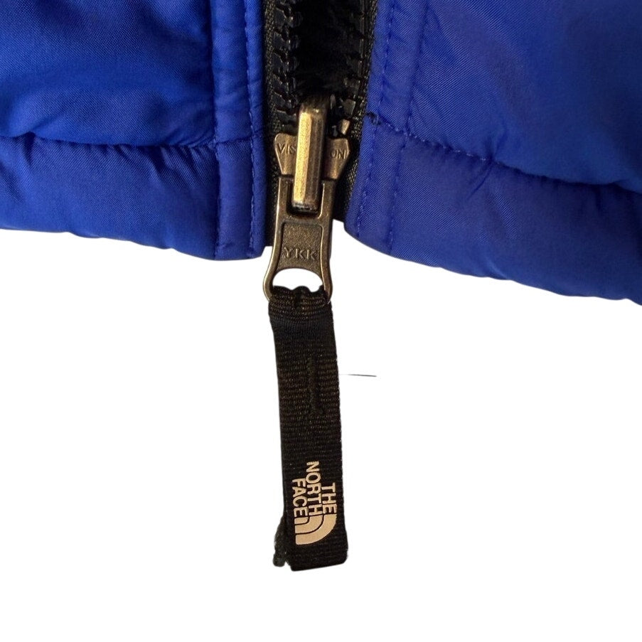 The North Face boys' reversible Mount Chimborazo puffer jacket in blue and black, fleece-lined, size large, with quilted exterior.