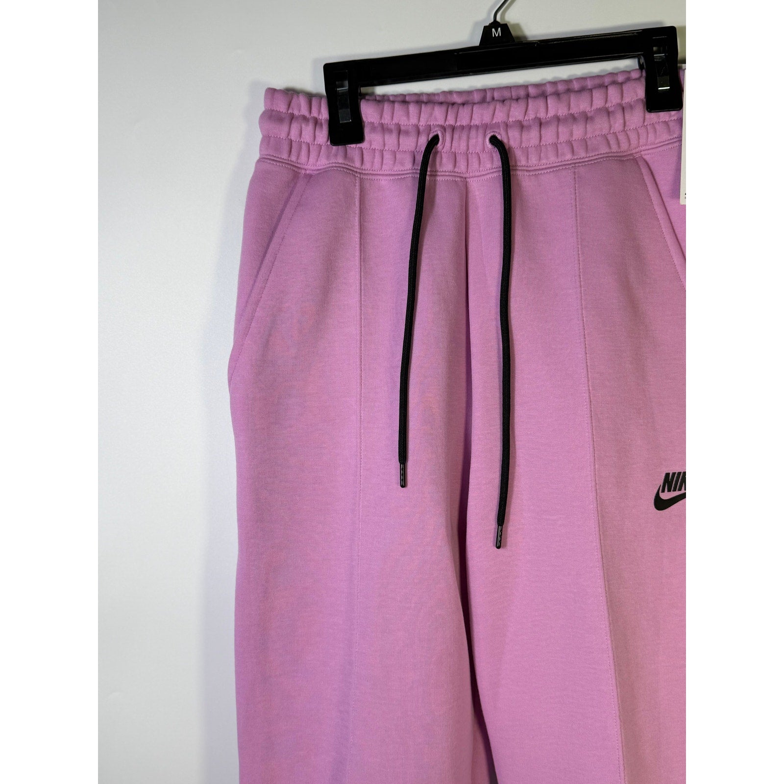 Women’s Nike Sportswear Phoenix Fleece Jogger Sweatpants in pink, mid-rise fit with XS size and comfortable fleece material.