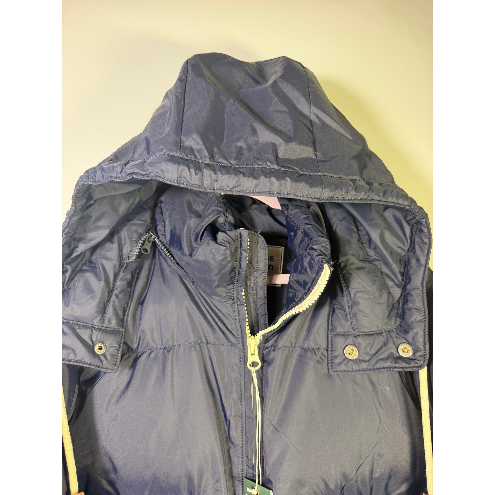 Alpine Design men's AD 1962 hooded puffer jacket in deep navy, size large, showing front view with hood and quilted design.