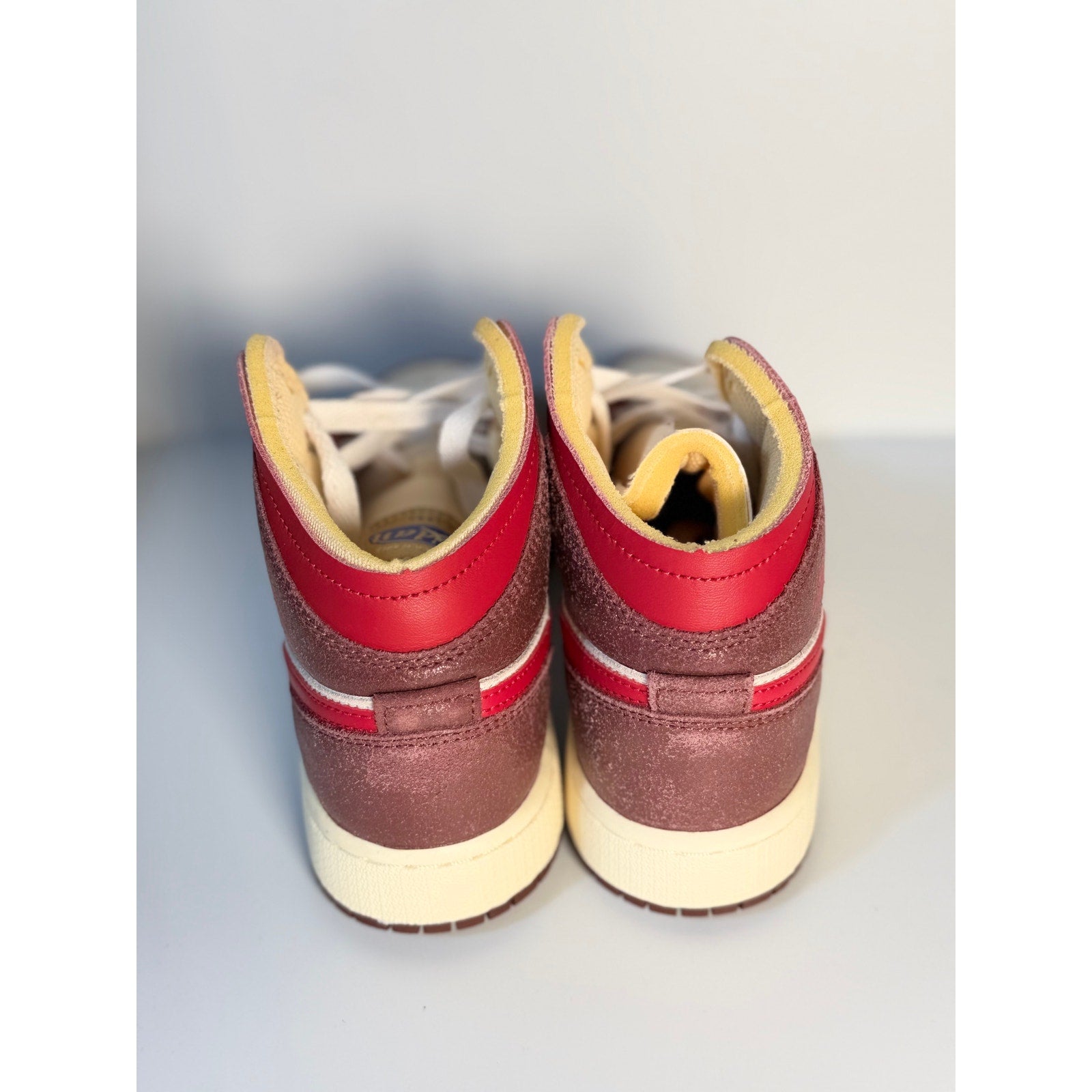 Nike Air Jordan 1 Mid SE Craft sneakers in sail, red, and brown with leather and suede details, men's size 4.