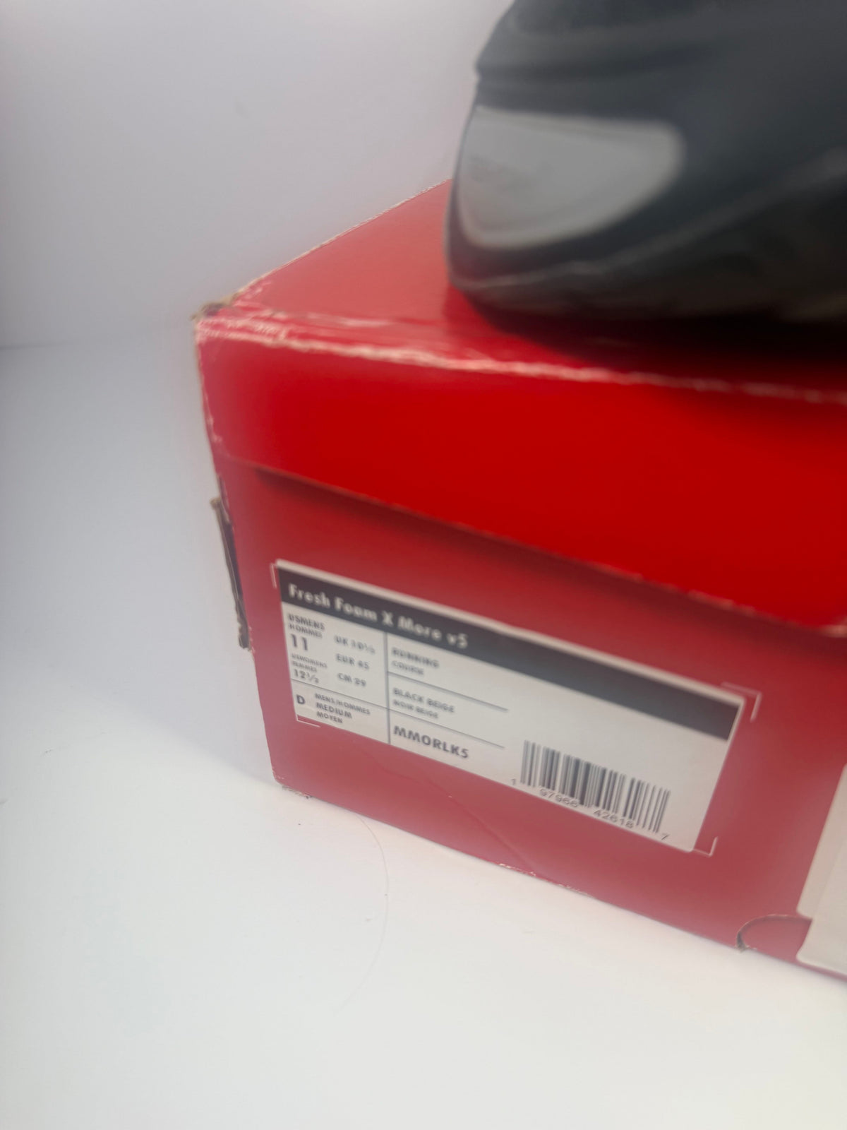 Black New Balance Fresh Foam X More v5 running shoes for men, size 11, featuring athletic design and supportive cushioning.