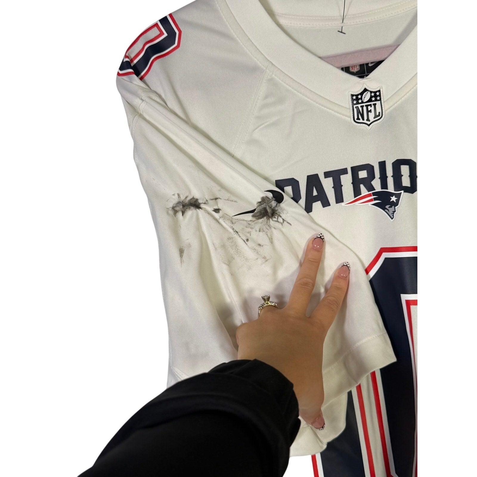 Nike NFL New England Patriots Drake Maye #10 white jersey for men, large size, with team logo and player number visible.