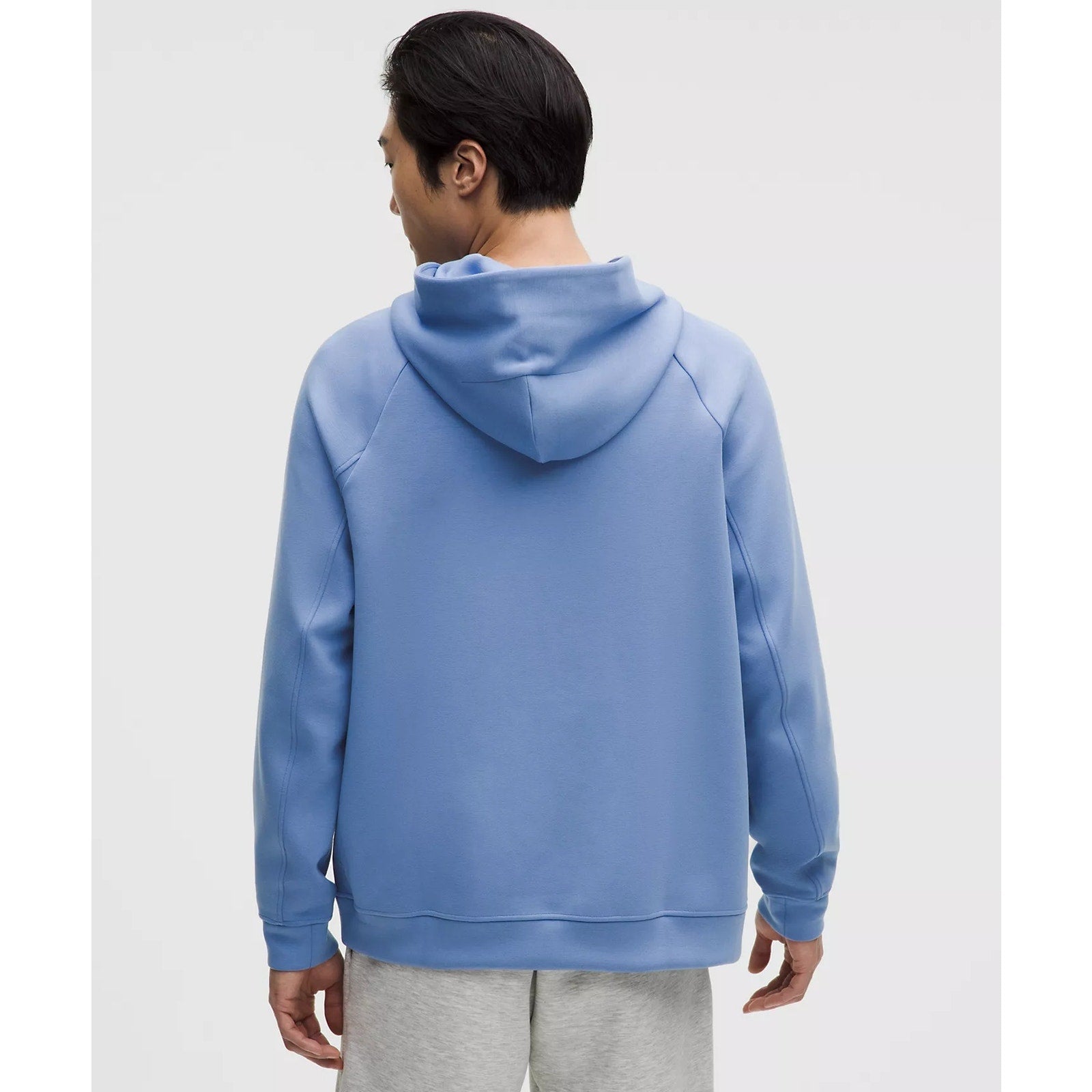 Men's Lululemon Smooth Spacer Pullover Hoodie in blue, showing the comfortable fabric and relaxed fit.