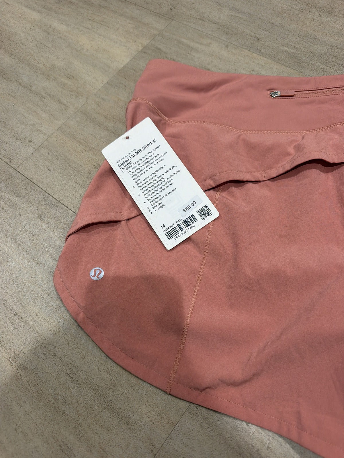 Lululemon Speed Up mid-rise lined pink Savannah women's running shorts, size 14, with a 4-inch inseam and reflective details.