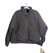 Black Free People Movement Pippa packable puffer jacket with PrimaLoft insulation, women's XS, shown folded and partially unfolded.