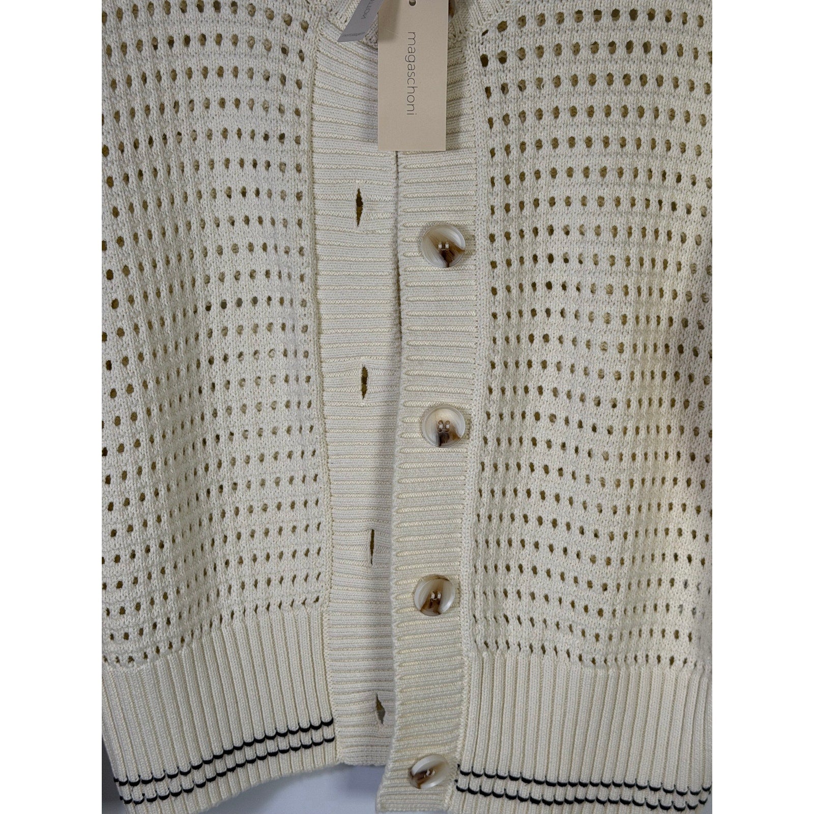 Magaschoni women's cream open-knit button cardigan sweater, size large, displayed flat with buttons visible and soft knit texture.