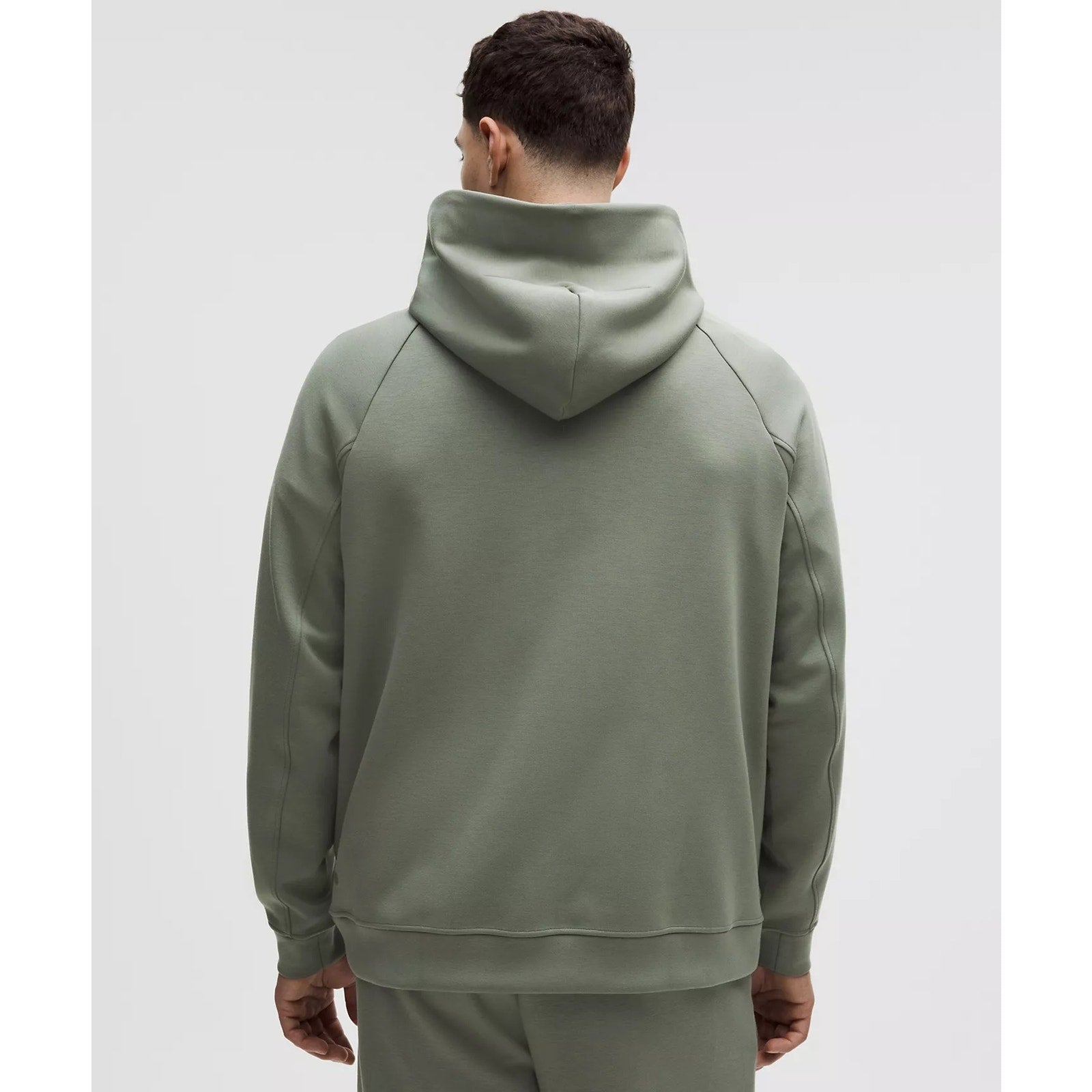 Men's green Lululemon Smooth Spacer Pullover Hoodie, medium size, showing front view with soft, breathable fabric.