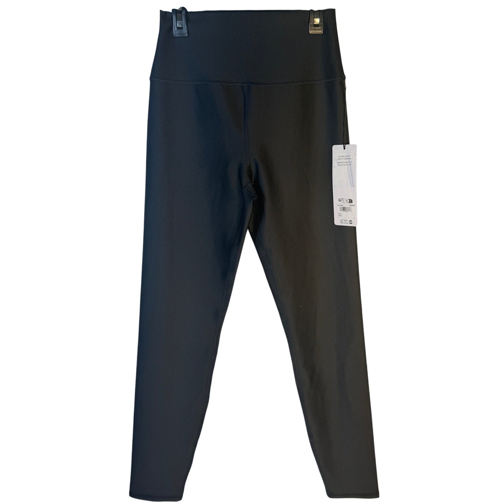 Black Alo Yoga Airlift 7/8 high waist leggings for women, showing the fitted design and logo detail.