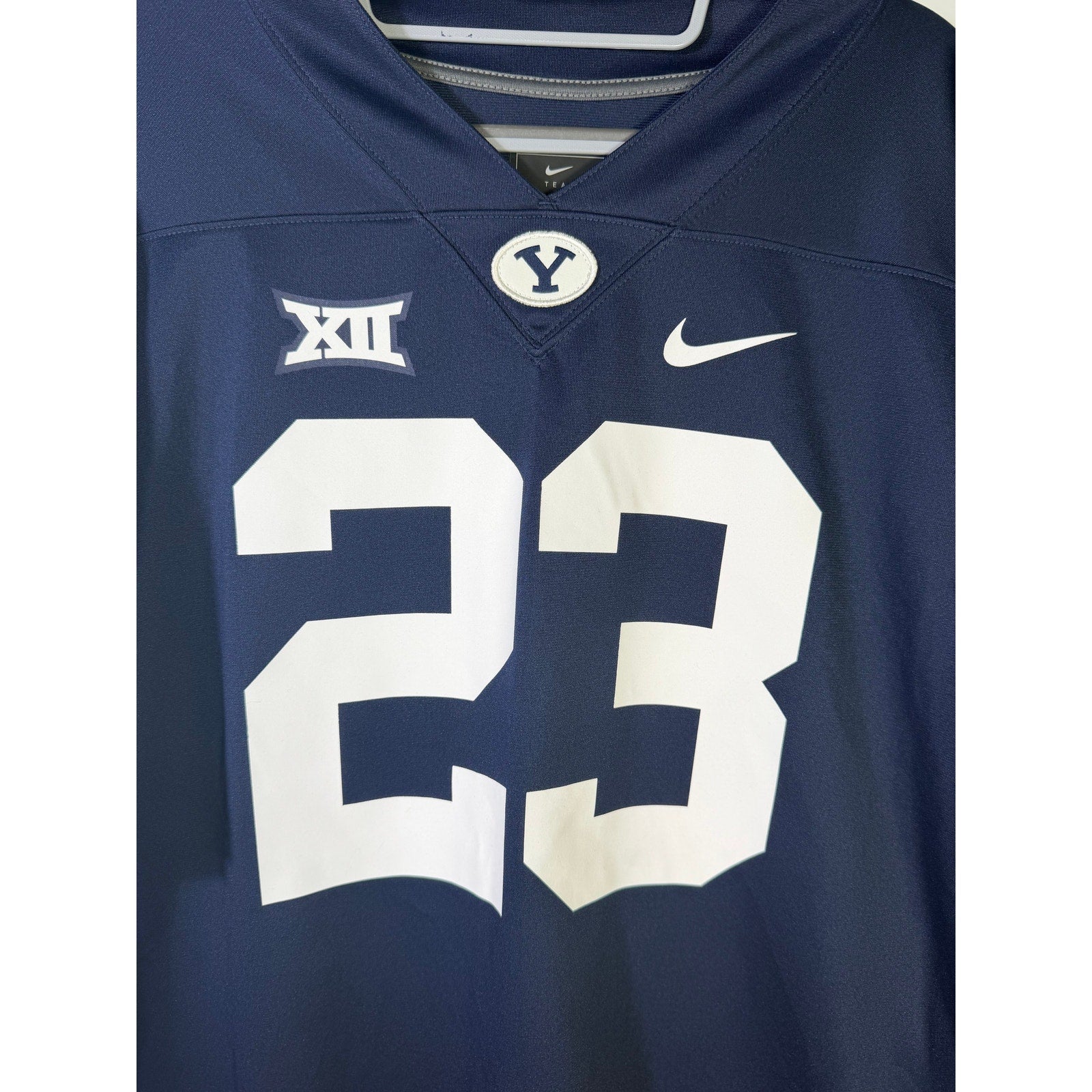 Nike BYU Cougars #23 men's navy replica football jersey, size large, new with tags, featuring team logo and player number.