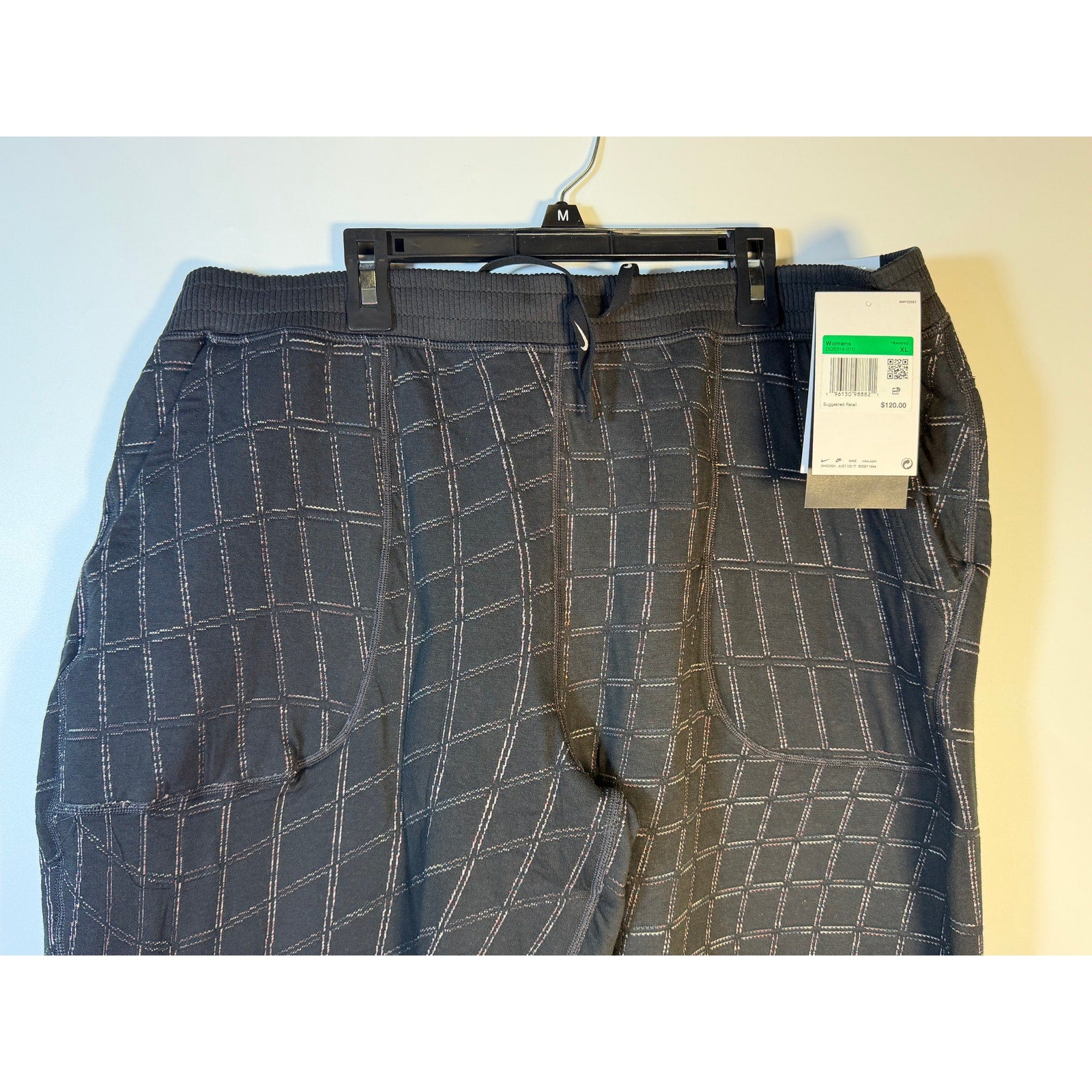 Nike Women's Yoga Luxe Grid Print Jogger Pants in black, featuring a comfortable fit and stylish design for training and casual wear.