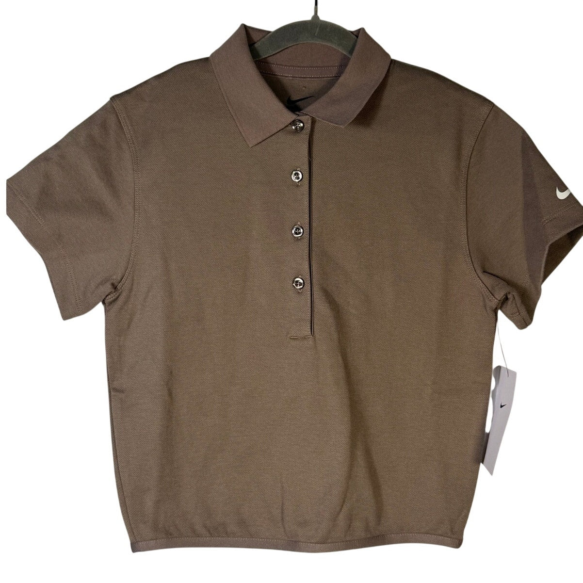 Nike women’s short-sleeve golf polo in Mink Brown, size XS, featuring a fitted design and breathable fabric.