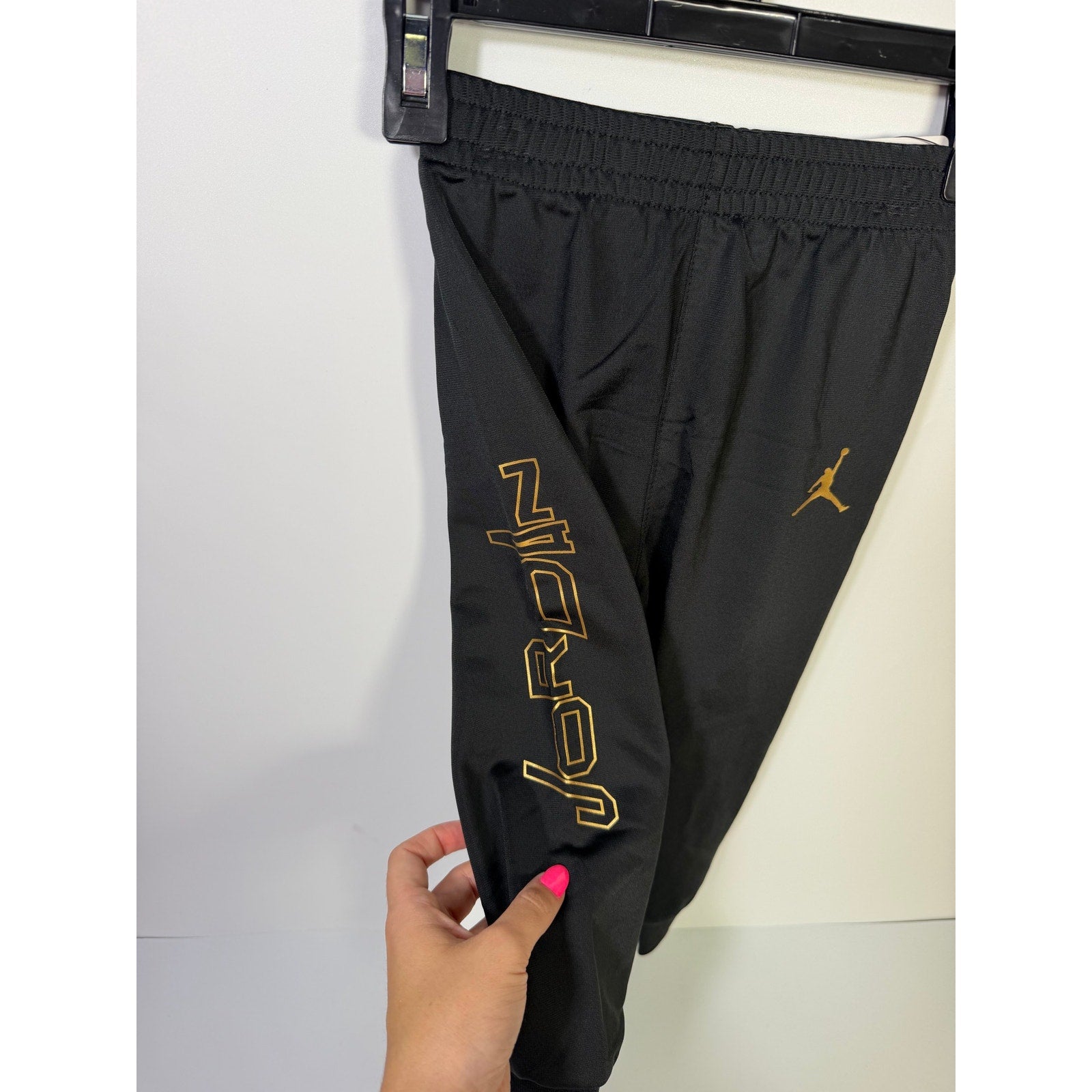 Jordan baby boys 2-piece black and gold track jacket and jogger set, size 18 months, new with tags, casual athletic clothing.