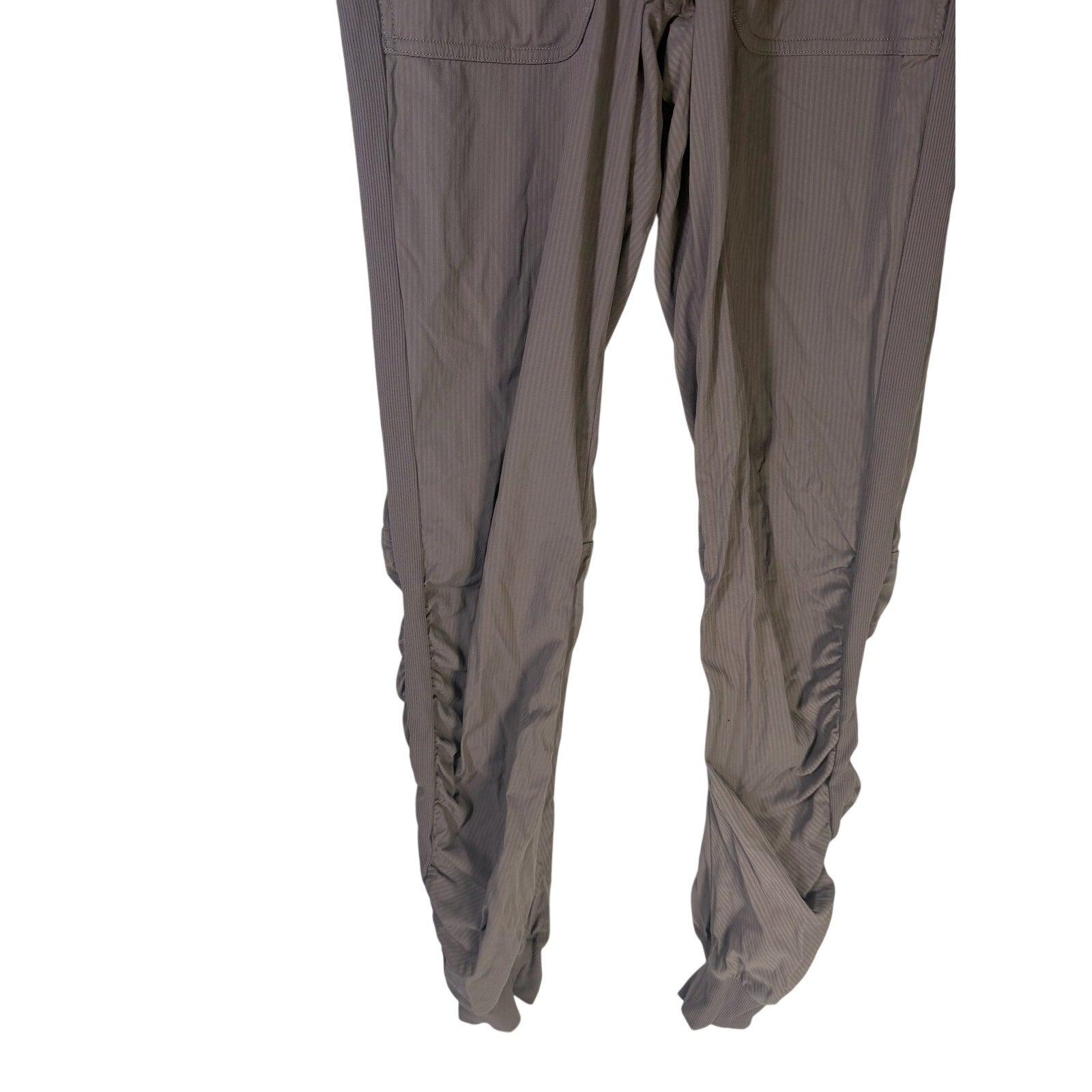 Lululemon women's high-rise taupe gray tapered pants with ruched detailing, size 4, preowned, casual and comfortable fit.