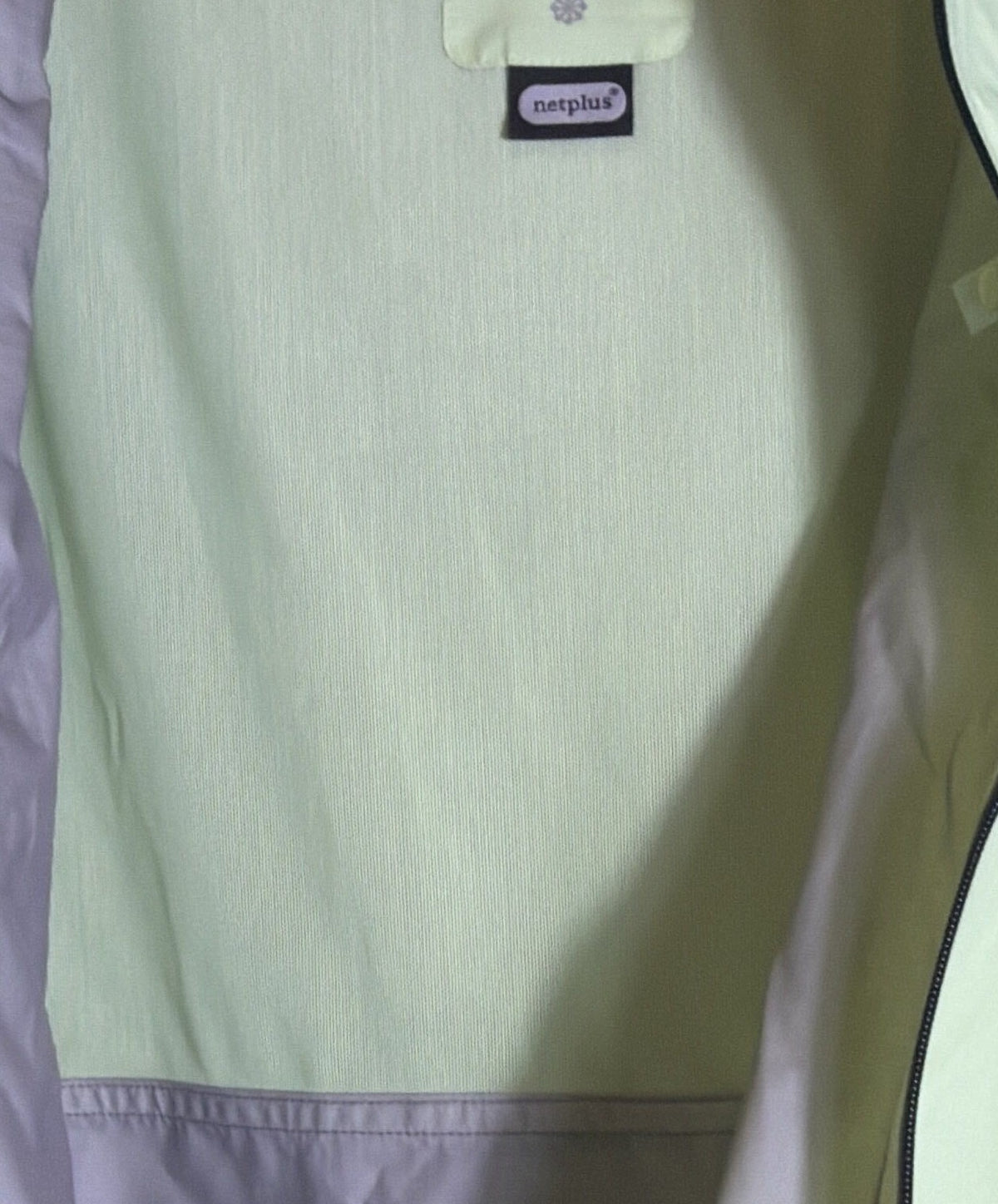 Nike Trail Storm-FIT ADV men's lime green running jacket, front view showing lightweight waterproof design and full zip closure.
