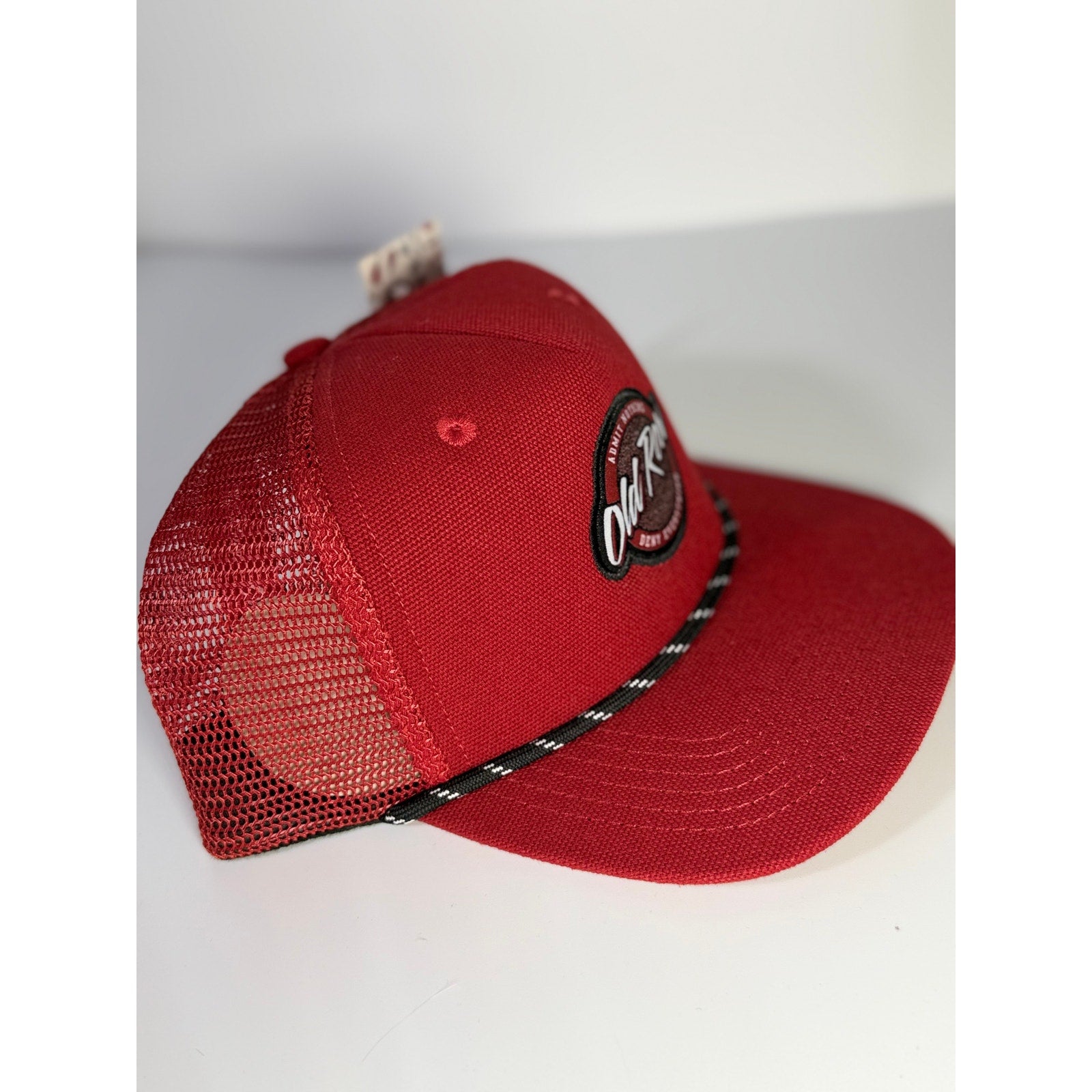 Red Old Row Logo Rope Trucker Hat with snapback closure, adult one size fits all, stylish baseball cap for casual wear