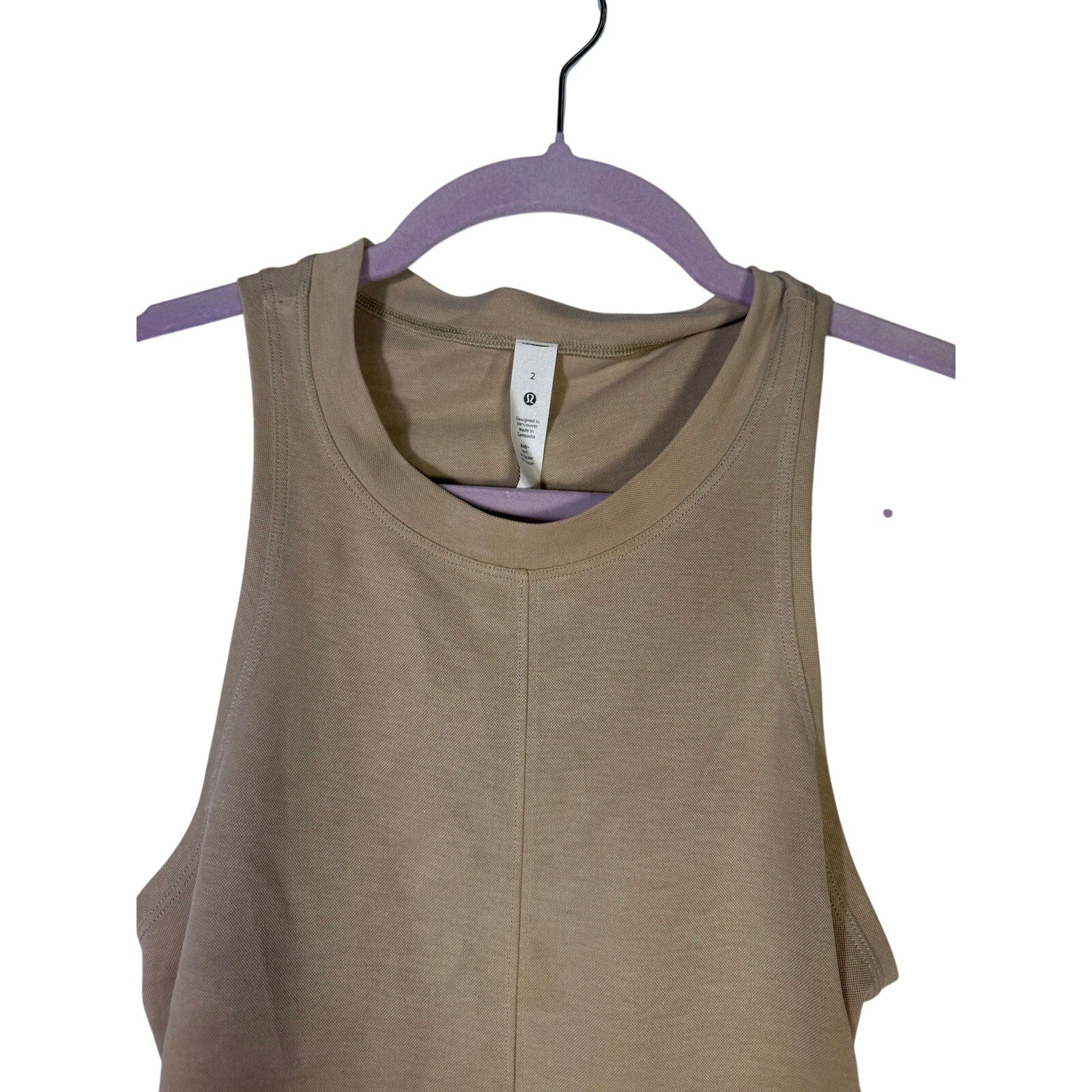 Lululemon women's beige Back Vent Tank Dress with open back and size 2, lightweight athletic dress for active wear.
