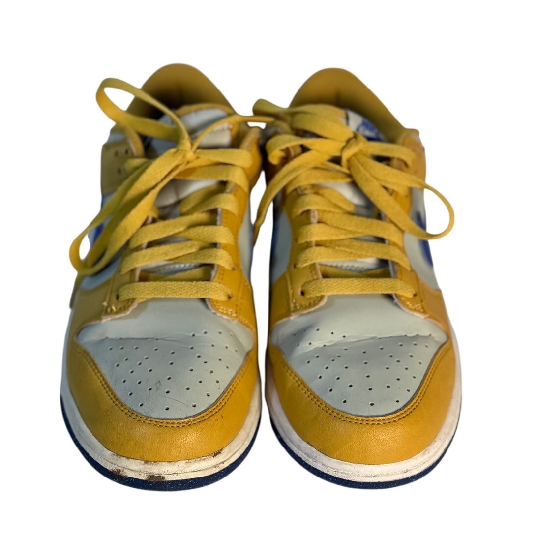 Nike Dunk Low GS sneakers in white leather with University Gold and Game Royal accents for youth, US 6Y.