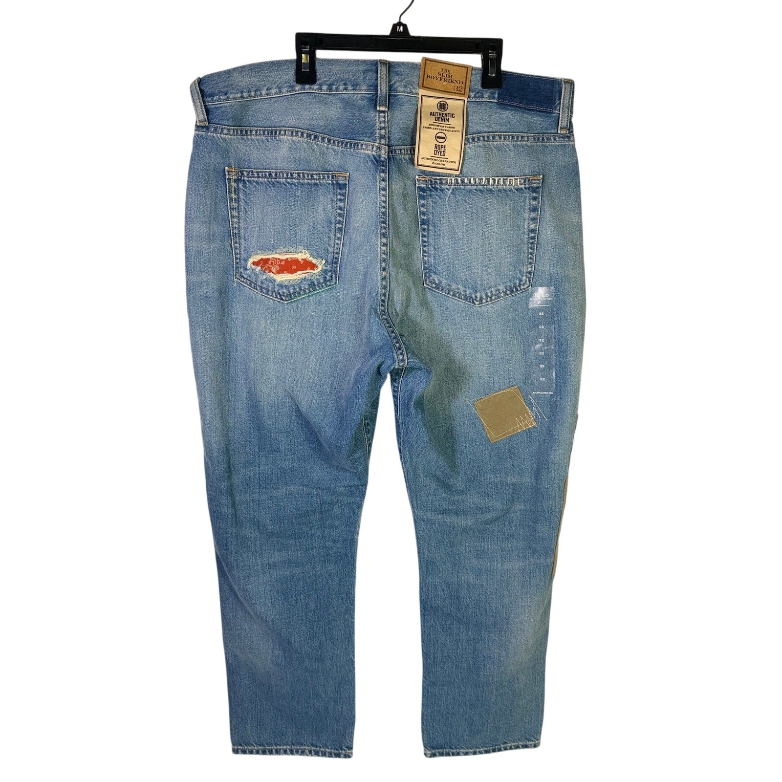 Polo Ralph Lauren men's slim boyfriend patchwork distressed jeans in size 32, showing the front with patch details and distressed fabric.