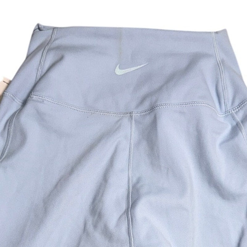 Nike women's high-rise blue training bike shorts, size XS, new with tags, shown on a plain background.