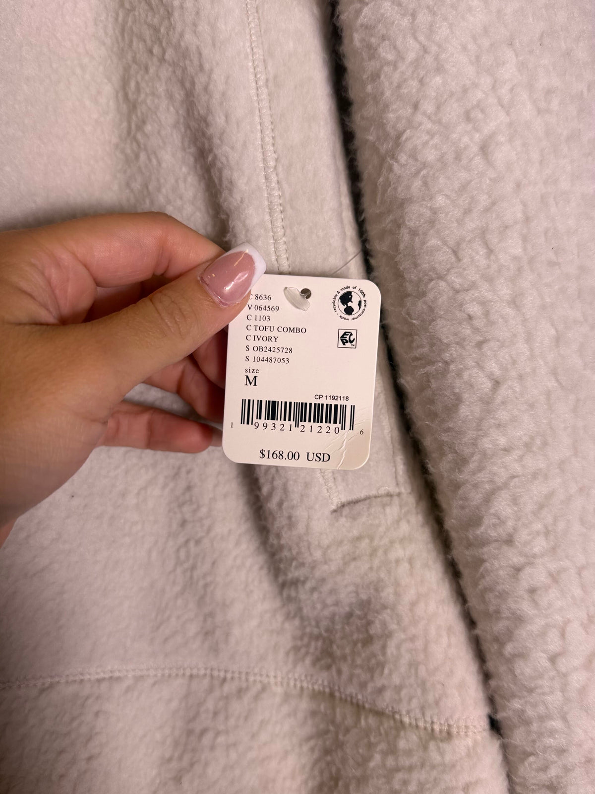Free People FP Movement ivory fleece pullover for women, featuring a soft, cozy design and Tofu Combo style, size M.