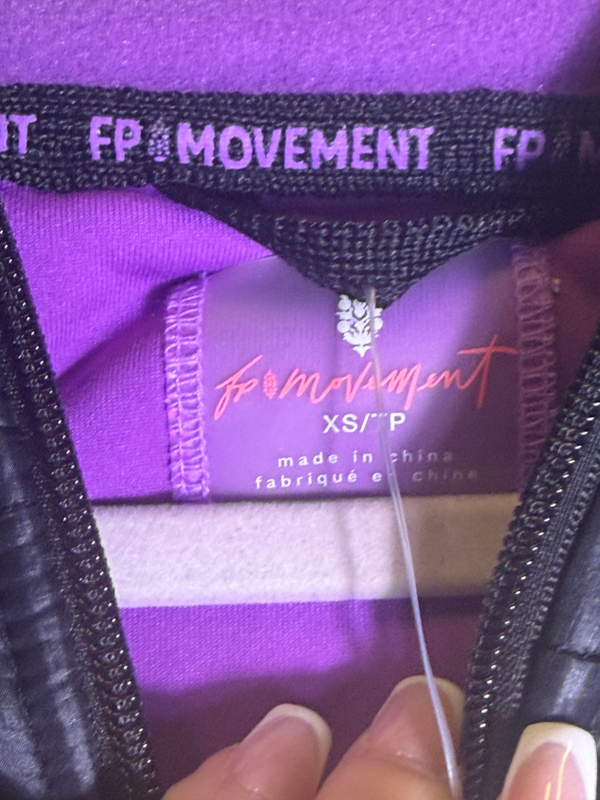 Free People Movement cropped hooded fleece jacket in violet and black, XS size, casual winter outerwear, front view