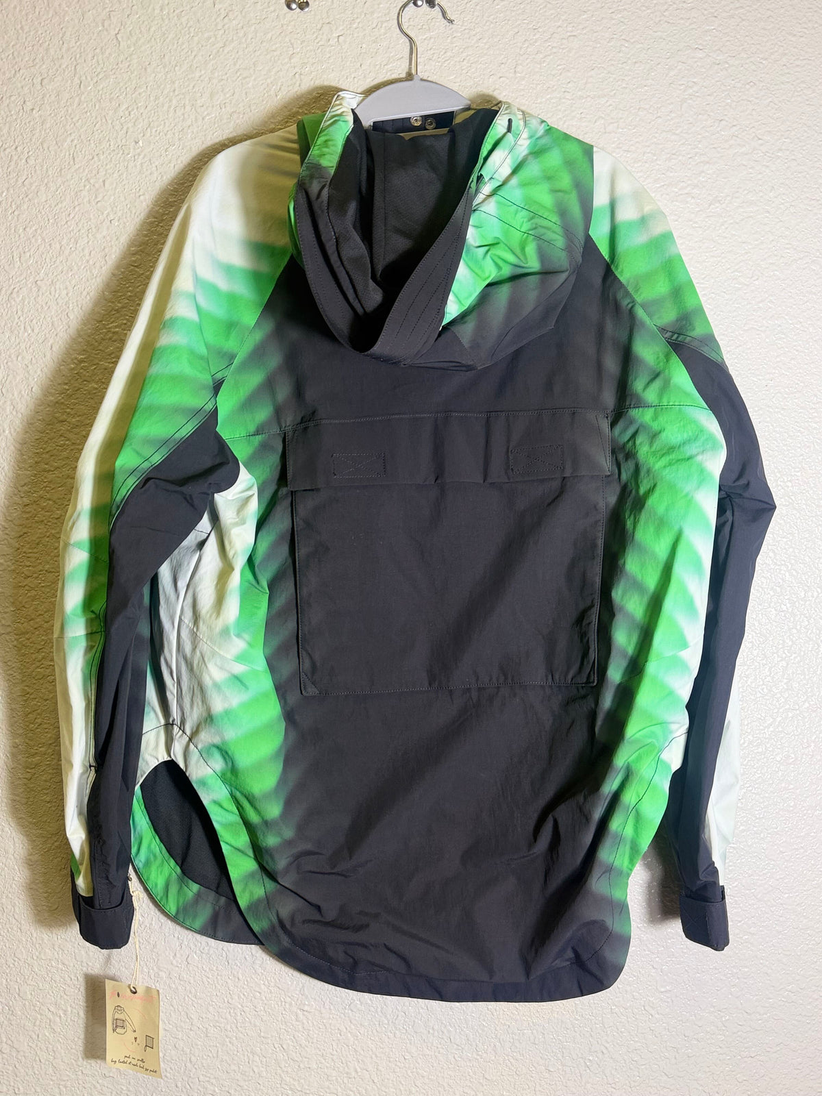 Green and black FP Movement Alien Combo hooded anorak jacket for women, XS size, featuring a stylish, lightweight outdoor design.