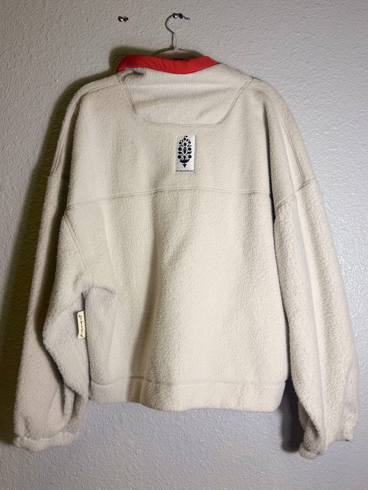 Free People FP Movement ivory fleece pullover for women, shown in Tofu Combo with a cozy, casual fit and soft fabric texture.