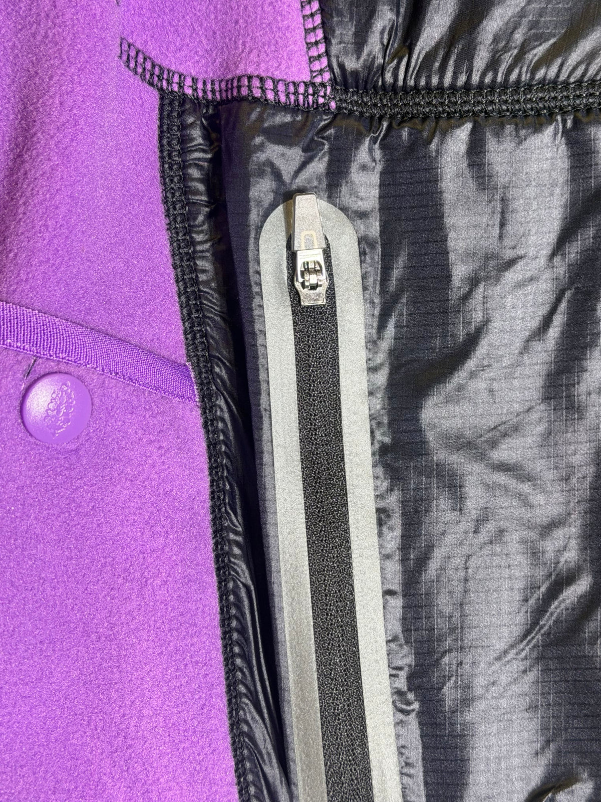 Free People Movement cropped hooded fleece jacket in violet and black, lightweight and cozy, size XS.