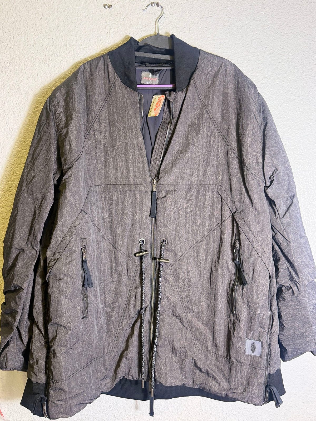 Gray Free People Movement oversized bomber jacket for women, showcasing the relaxed fit and stylish design.