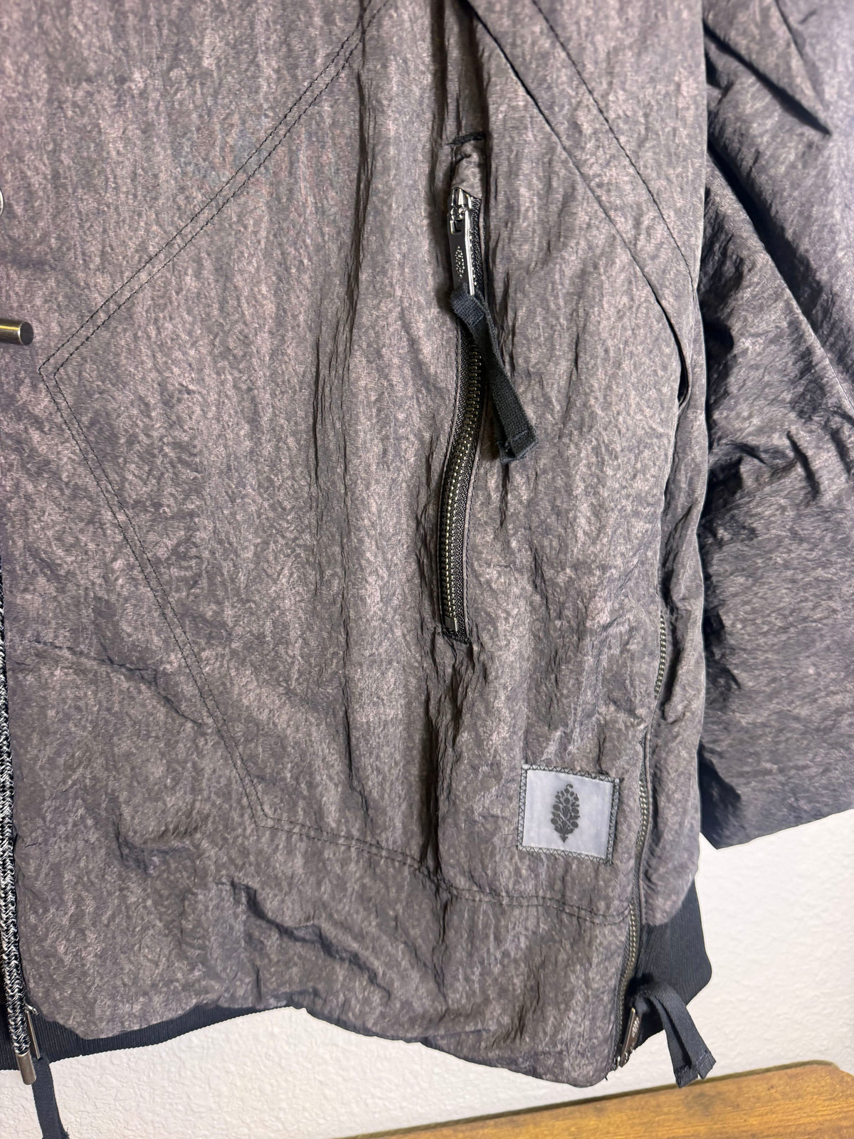 Gray Free People Movement oversized bomber jacket for women, shown on model, with casual style and relaxed fit.