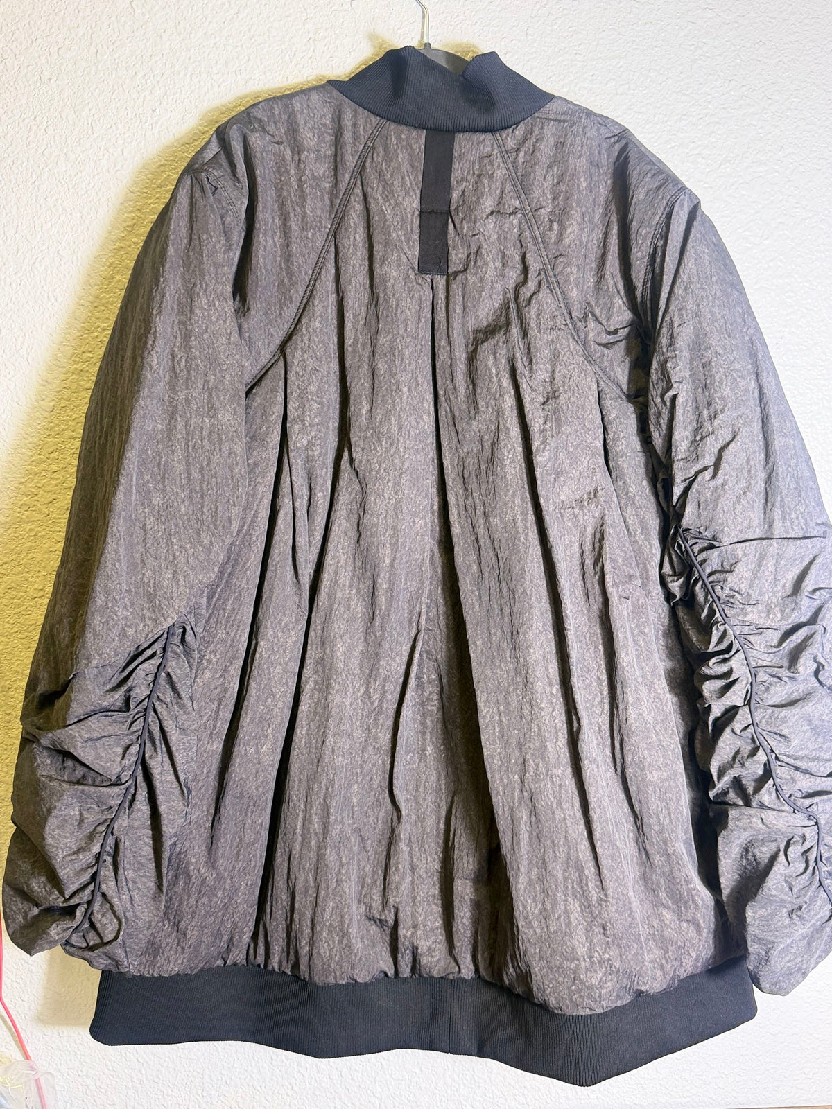 Gray Free People Movement oversized bomber jacket for women, showing the relaxed fit and stylish design.