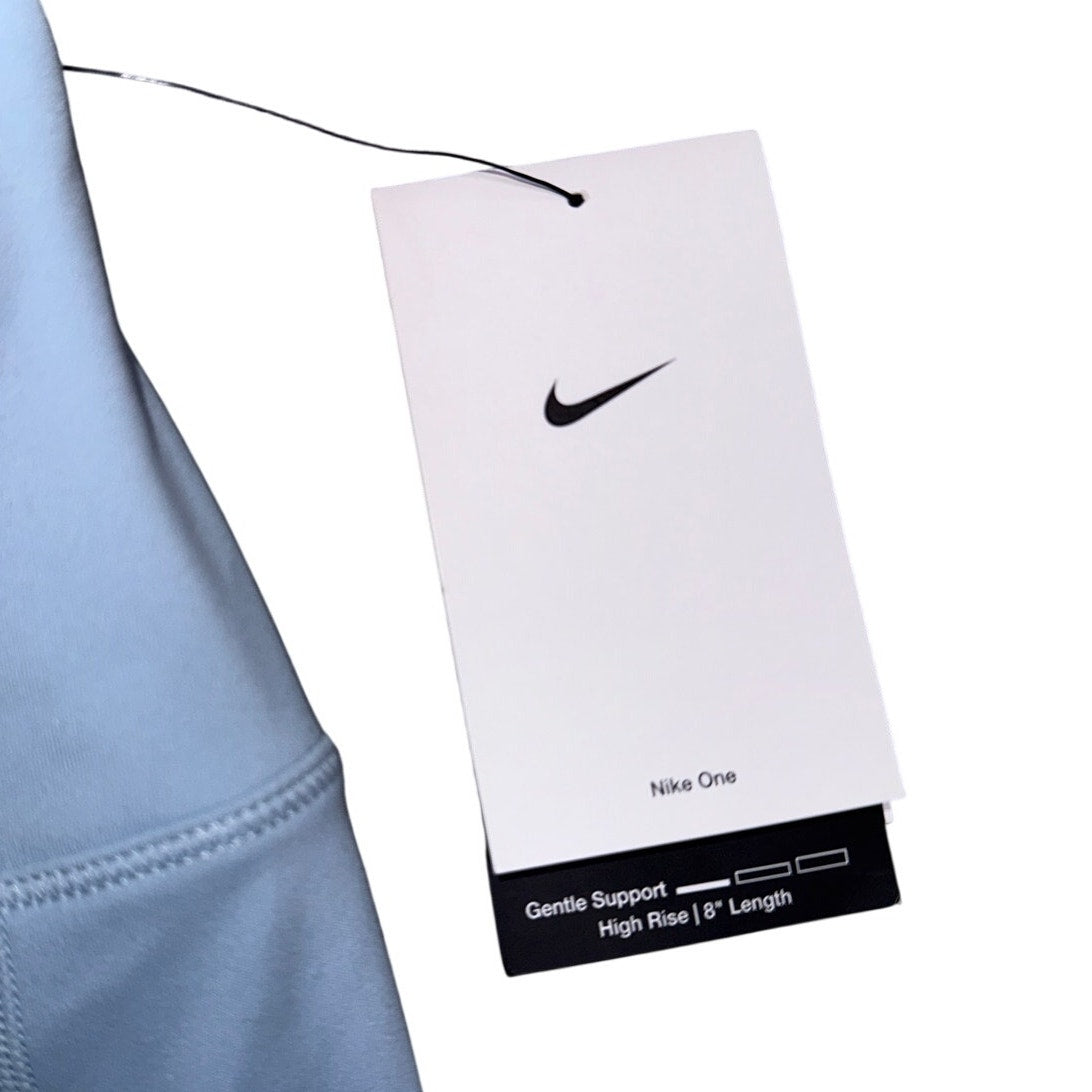 Nike women's high-rise blue training bike shorts, size XS, with an 8-inch inseam, new with tags, showcasing a comfortable athletic fit.