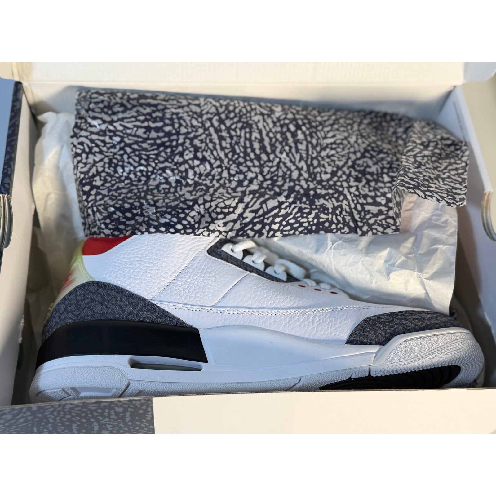 Air Jordan 3 Retro White Cement men's athletic sneakers, showcasing white leather with gray and orange accents, Nike branding.
