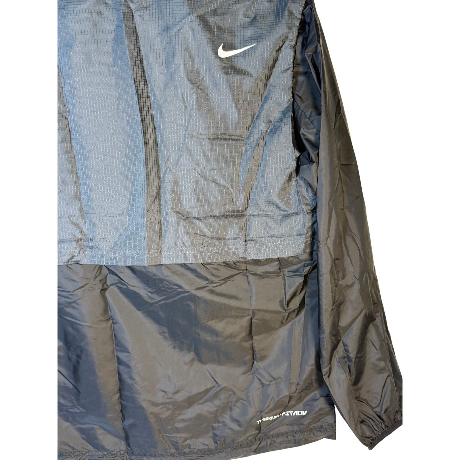 Nike Golf Therma-FIT Repel gray men's zip-up wind jacket, lightweight and full-zip design, suitable for outdoor activities.