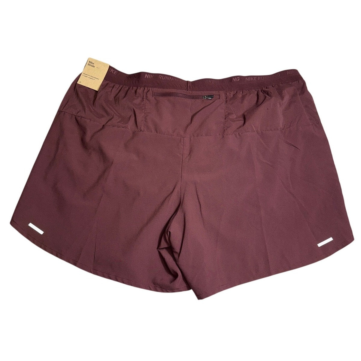 Men's Nike Stride Dri-FIT 5-inch running shorts in burgundy crush with Nike logo, shown flat with waistband and fabric details.