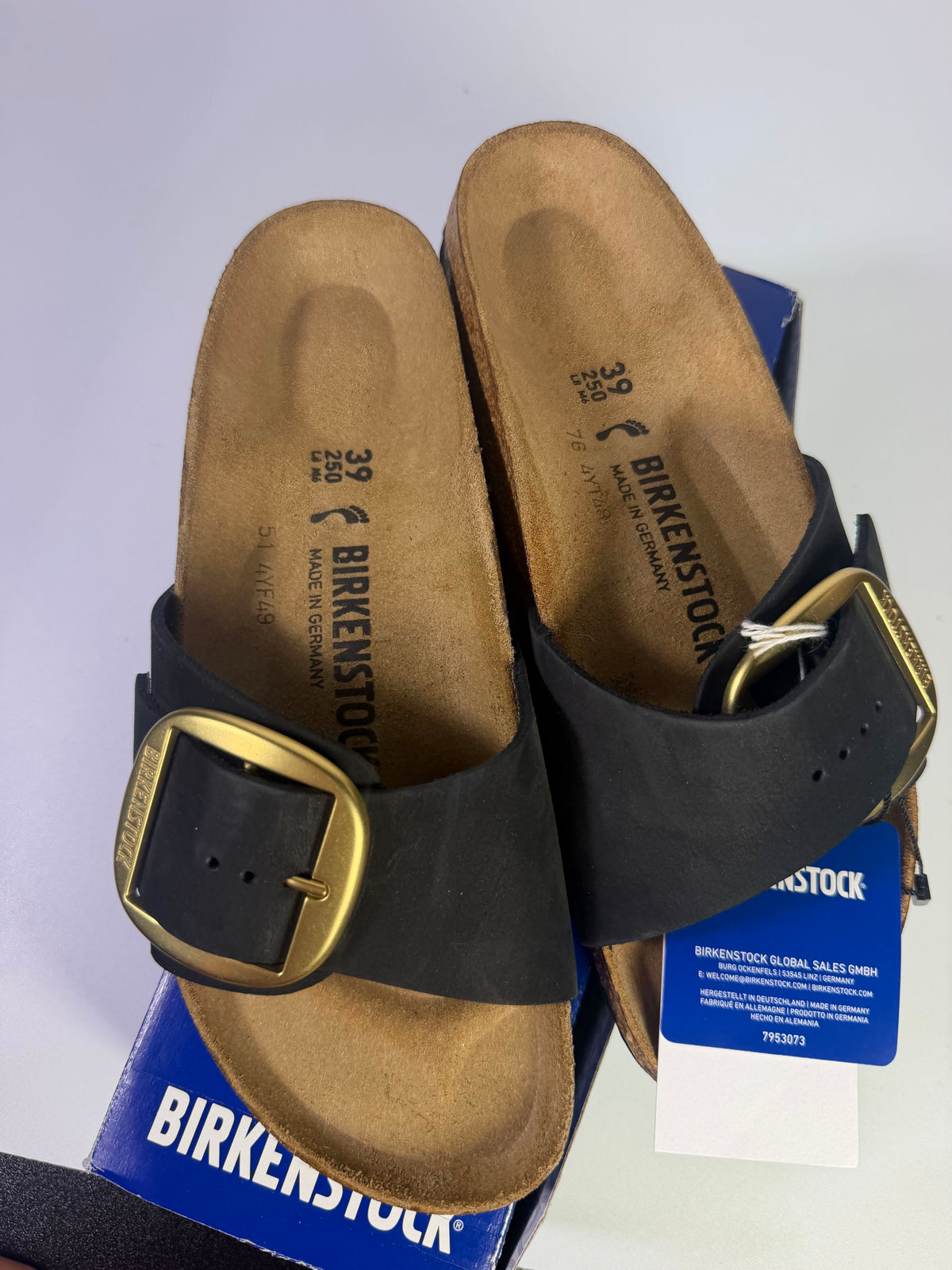 Black Birkenstock Madrid Big Buckle sandals in US size 8 for women, showing the classic slide design with a large buckle detail.