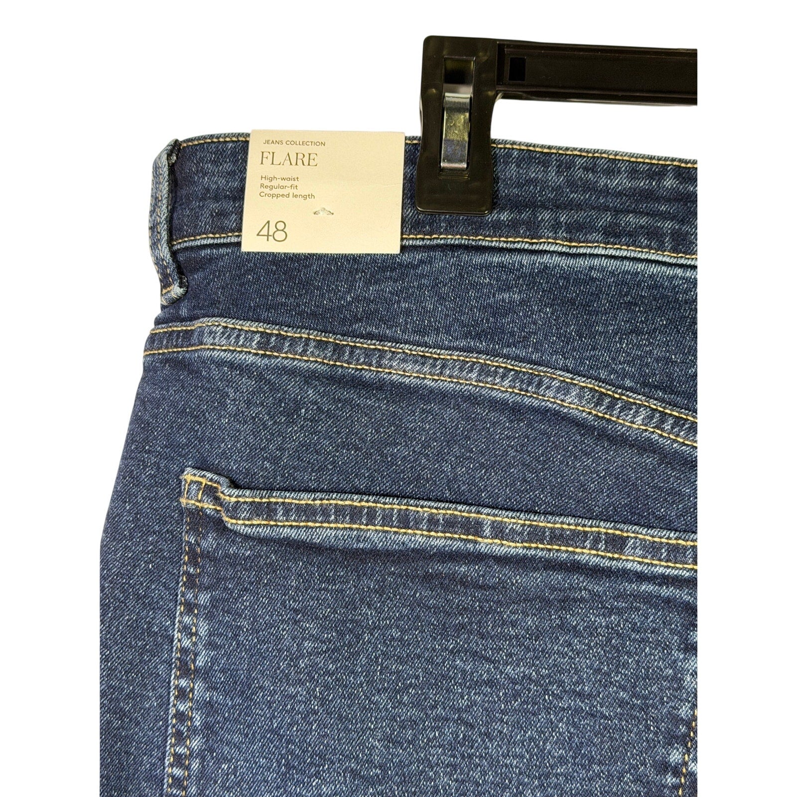 MNG women's medium wash straight leg jeans in size 16, showcasing classic denim fit and style on a hanger.