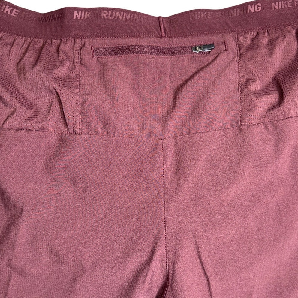 Nike Stride Dri-FIT men's 5-inch running shorts in burgundy, with athletic fit and moisture-wicking fabric.