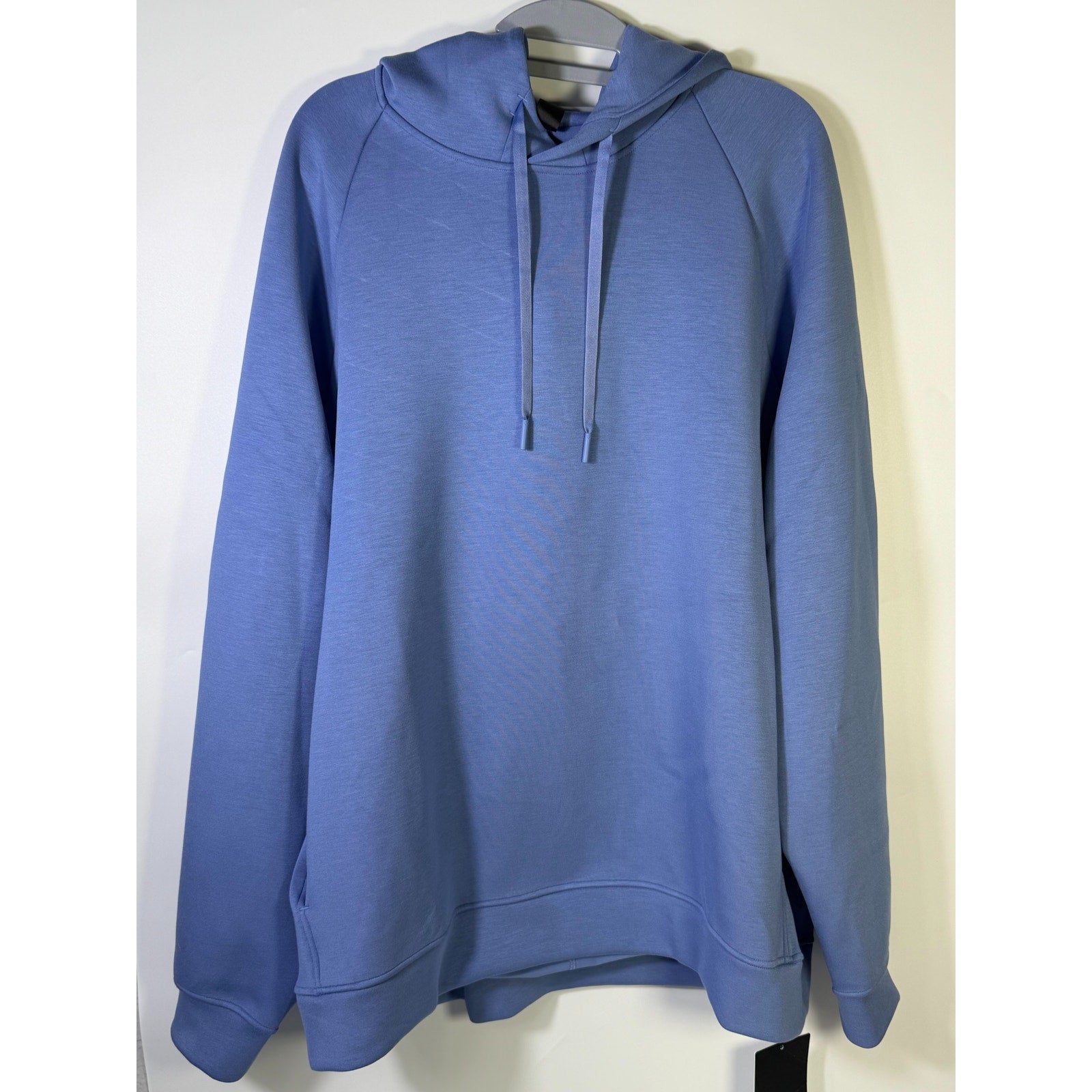 Men's blue Lululemon Smooth Spacer Pullover Hoodie, XL size, showing the soft textured fabric and relaxed fit.