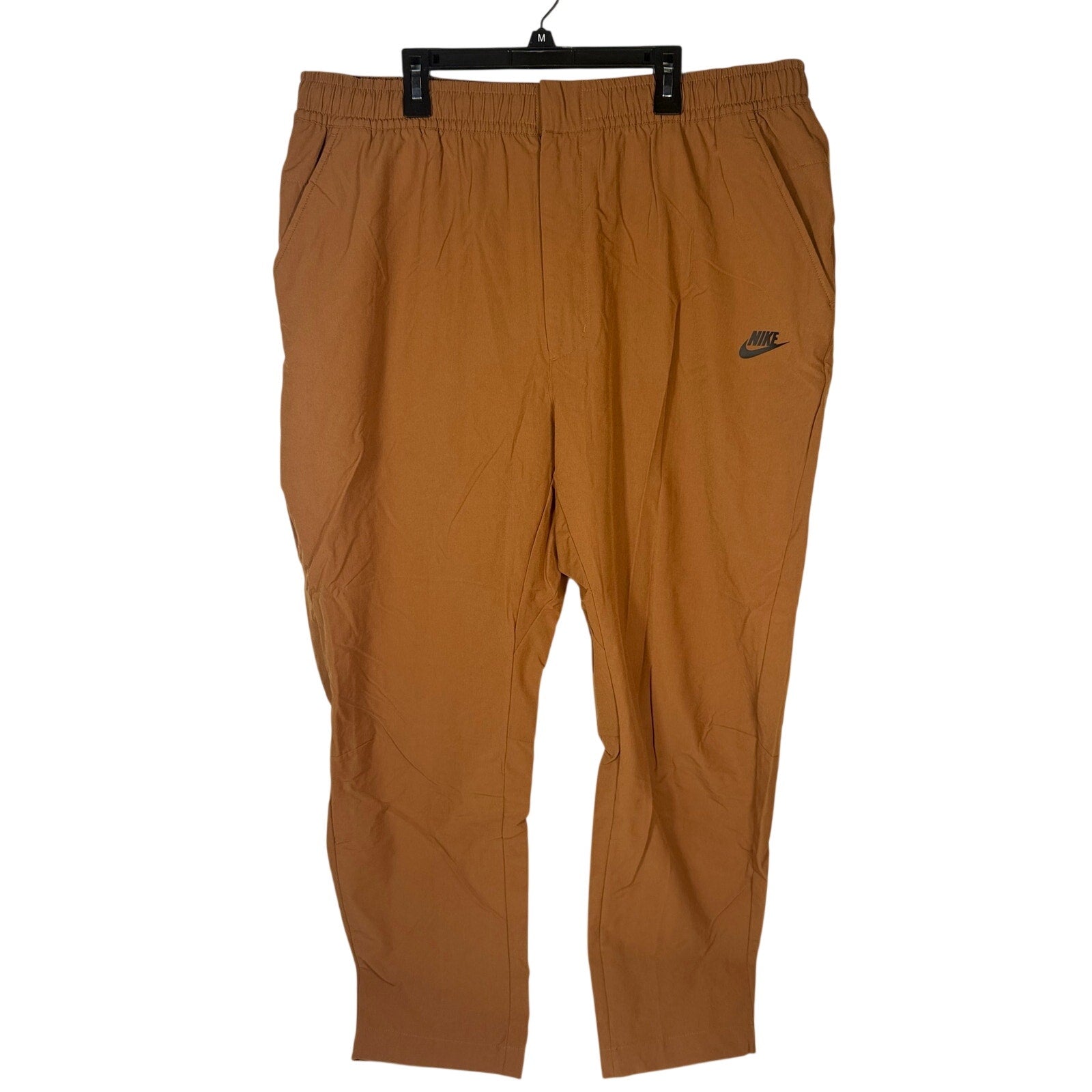 Nike Sportswear men's woven brown Cacao pants with elastic waist, size XXL, showcasing comfortable, casual style.