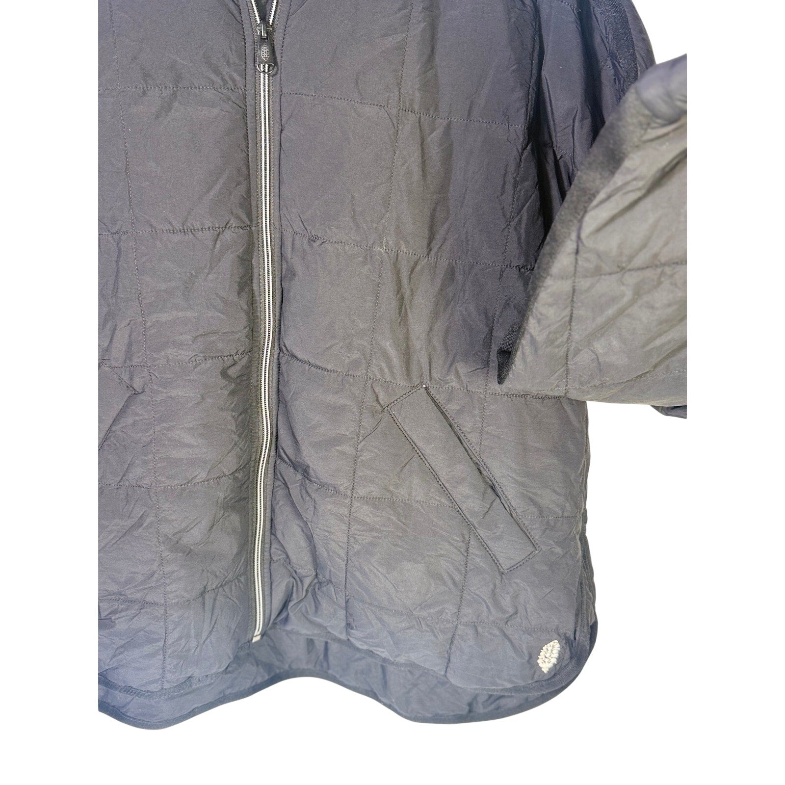 Black quilted Free People Movement women's full zip jacket, size large, displayed on a mannequin.
