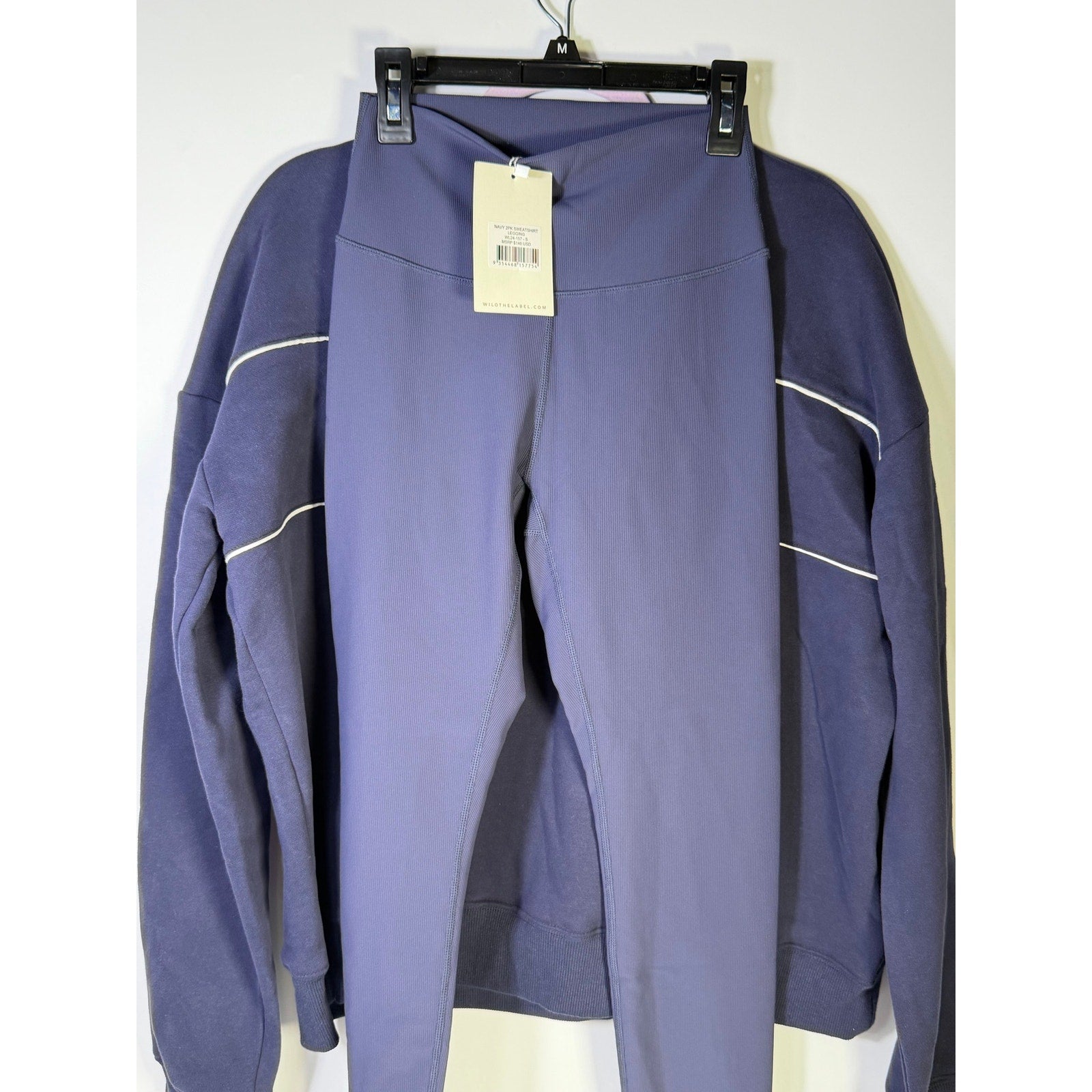 Wilo Women’s navy 2-piece sweatshirt and leggings set, size small, featuring comfortable fabric and casual style.