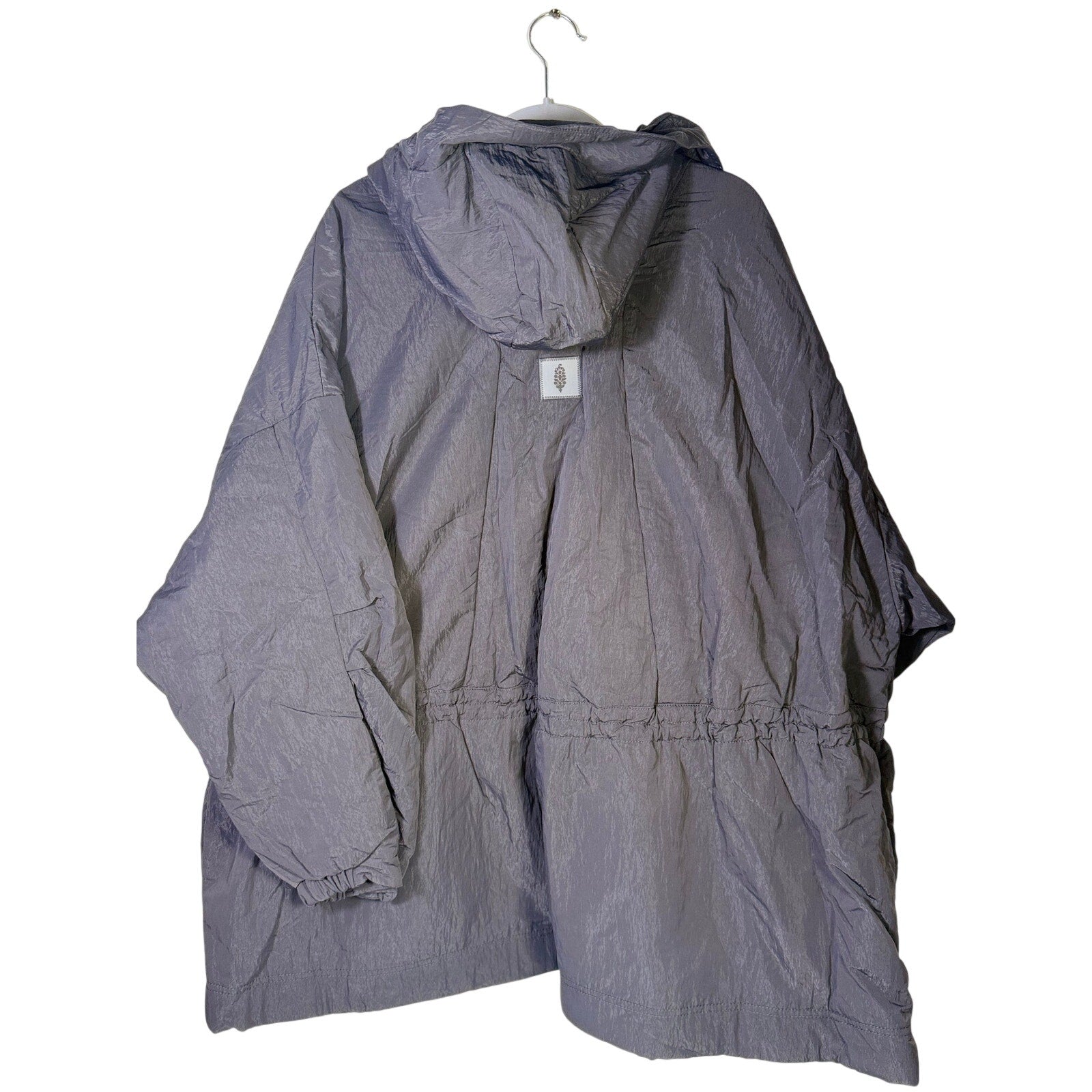 Black hooded utility jacket for women by Free People, featuring functional design and adjustable hood, size M/L.