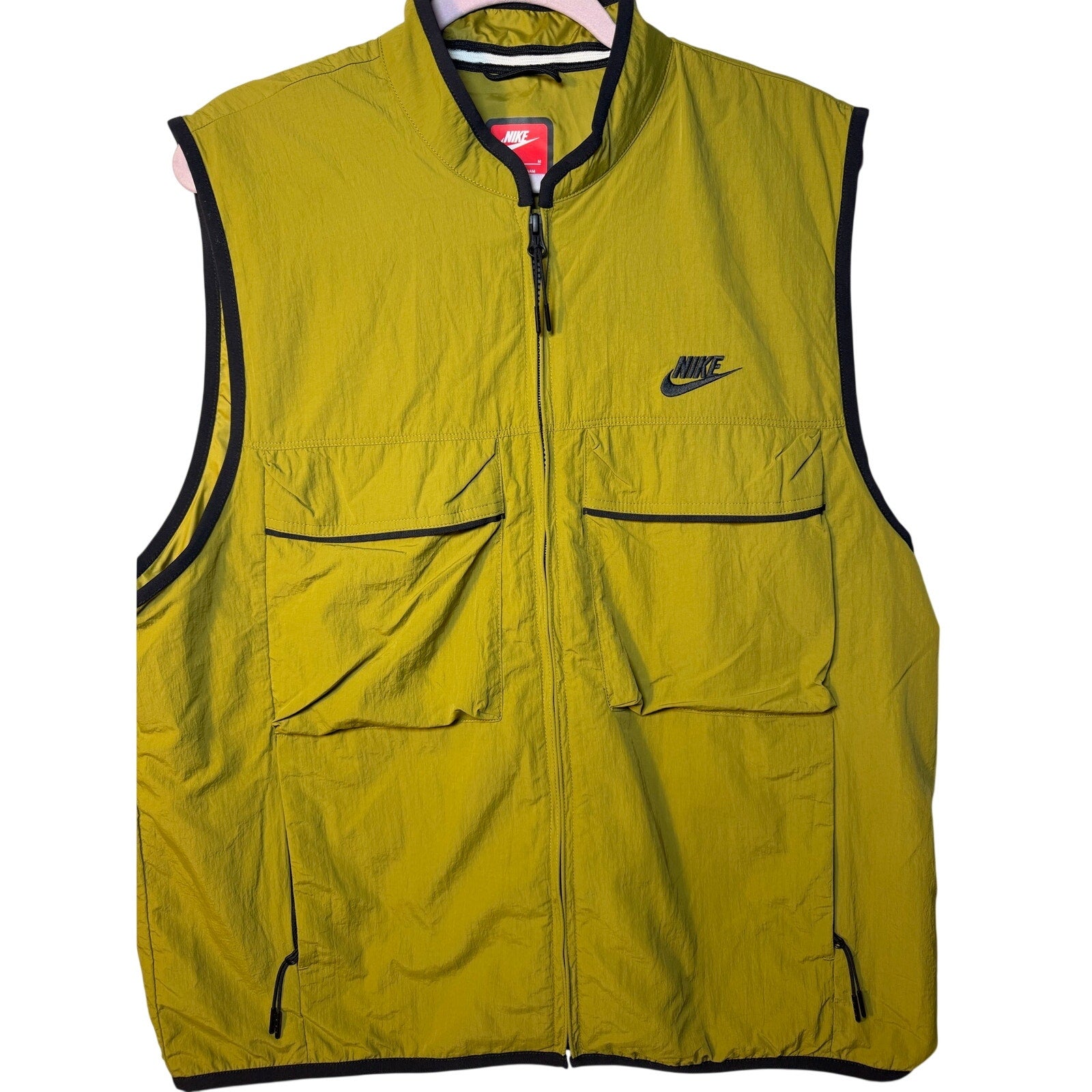 Nike Tech Woven Utility Wind Vest for men in green, size medium, full zip, lightweight and wind-resistant fabric.