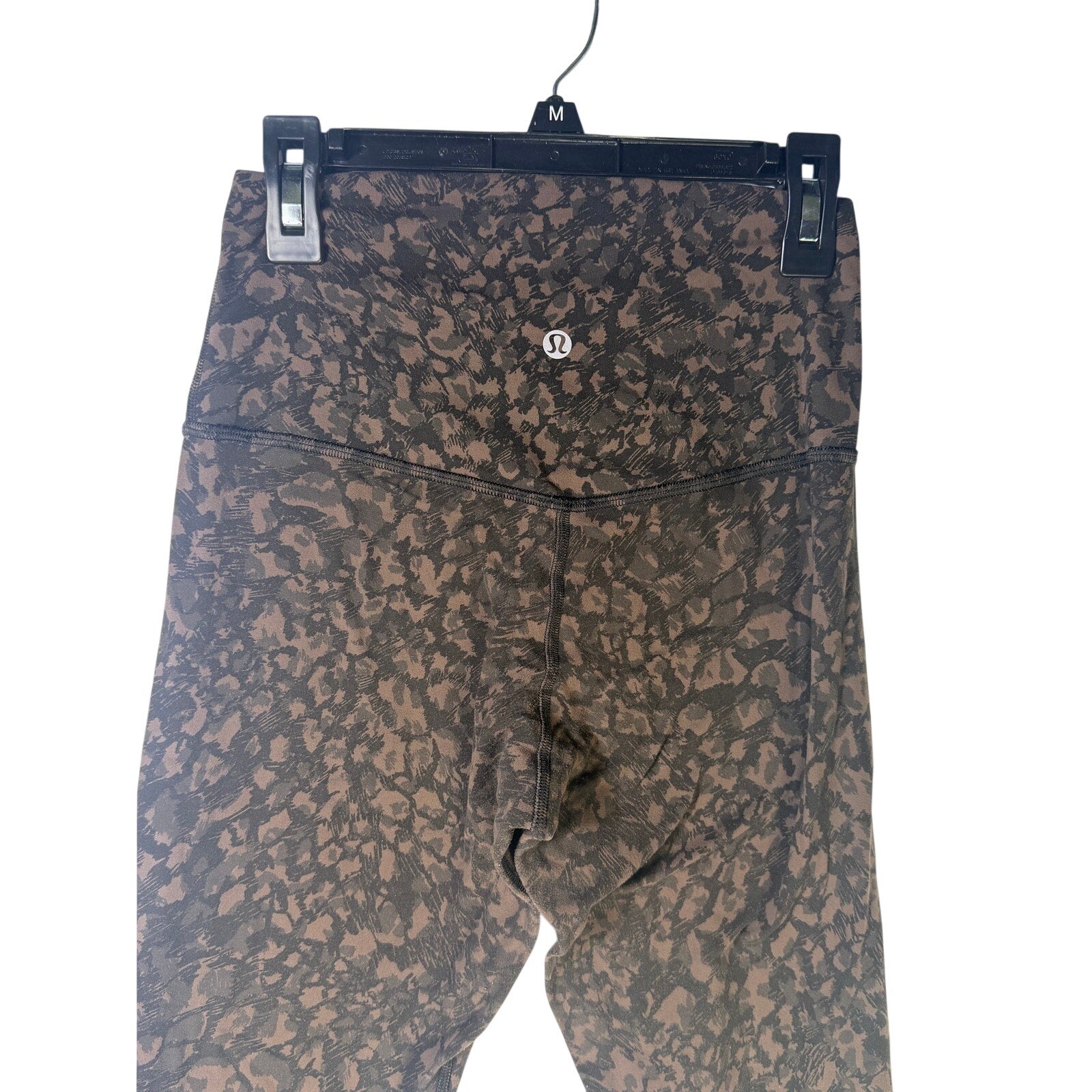 Lululemon women’s Align high-rise leggings in brown and black camo, size 4, featuring a 25-inch inseam and stretchy fabric.