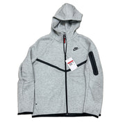 Nike Tech Fleece full-zip hoodie for big kids in dark grey heather, black, size L, with Nike logo and front pockets.