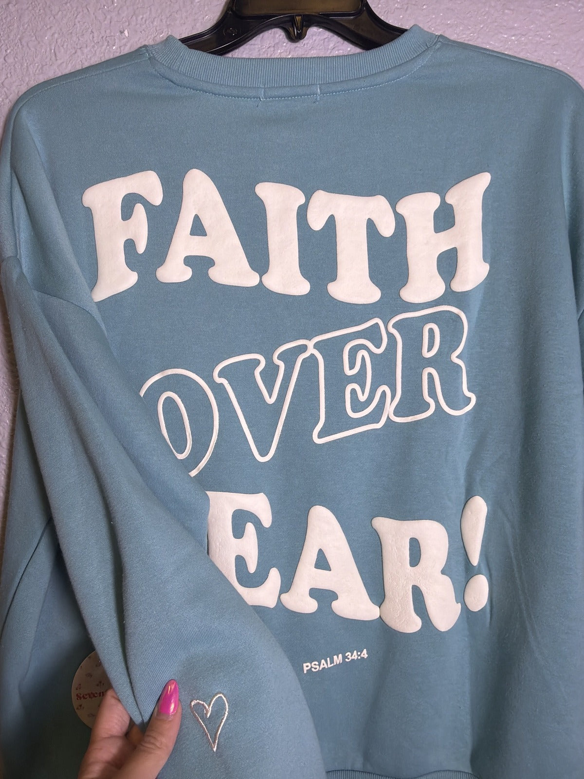 Seventh & Sunset Faith Over Fear Psalm 34:4 teal blue women's crewneck sweatshirt, front view, soft fabric and relaxed fit.
