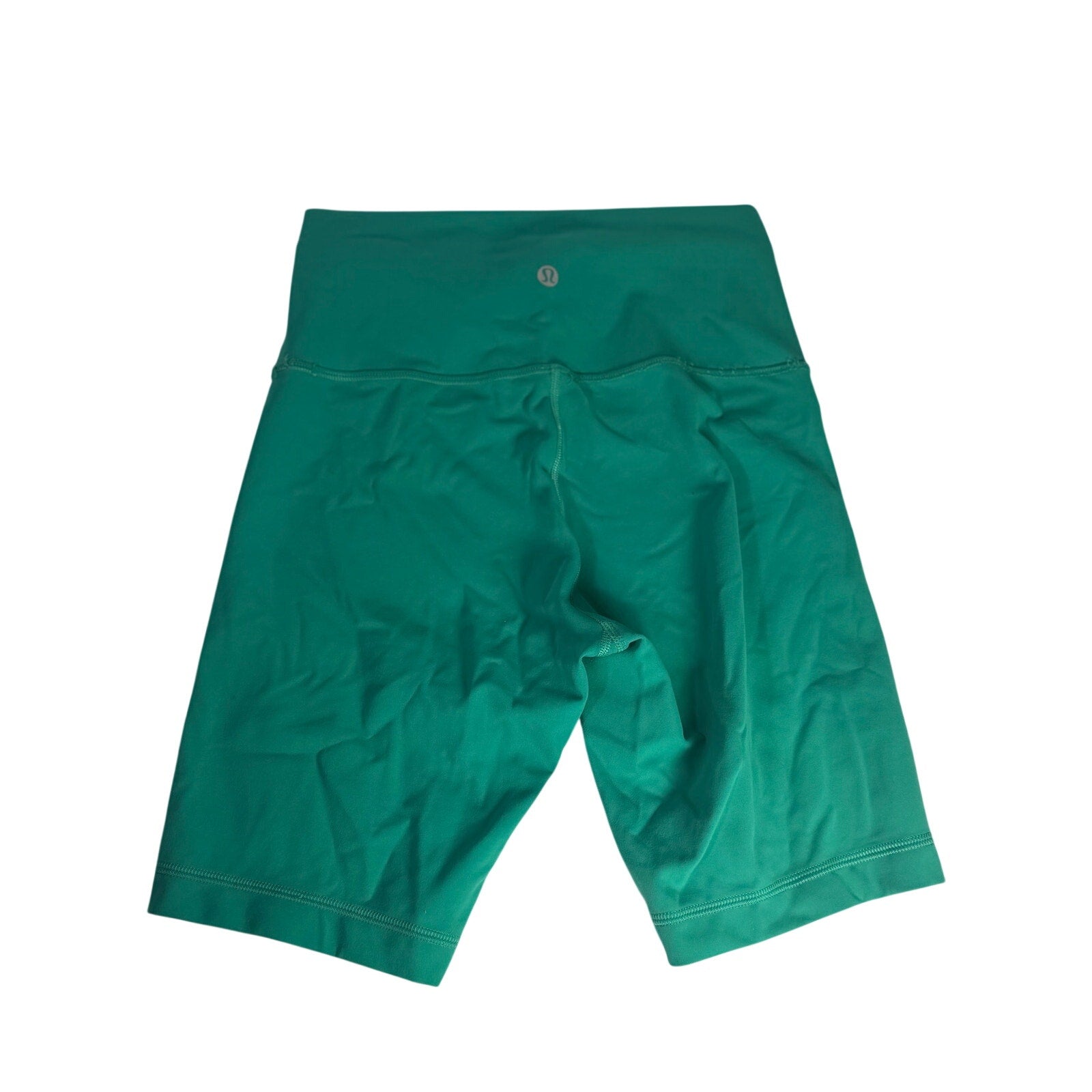 Lululemon women's high-rise teal green biker shorts size 6, close-up of comfortable athletic shorts with stretch fabric