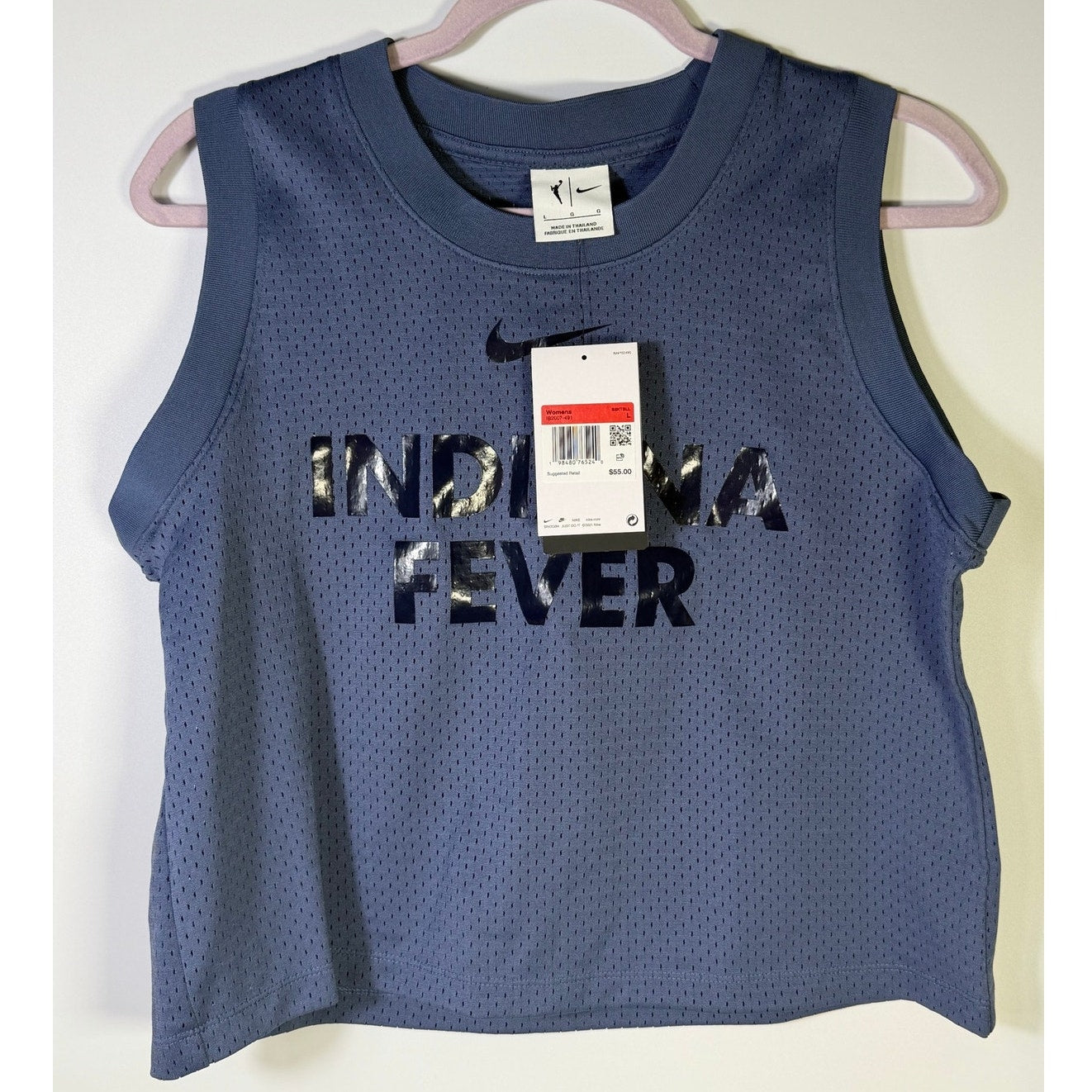 Nike WNBA Indiana Fever women's blue mesh basketball tank top, size large, lightweight athletic top with team logo and breathable fabric.
