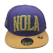 New Era NOLA Pelicans youth snapback hat in purple and gold with NBA logo, featuring a structured crown and flat brim.